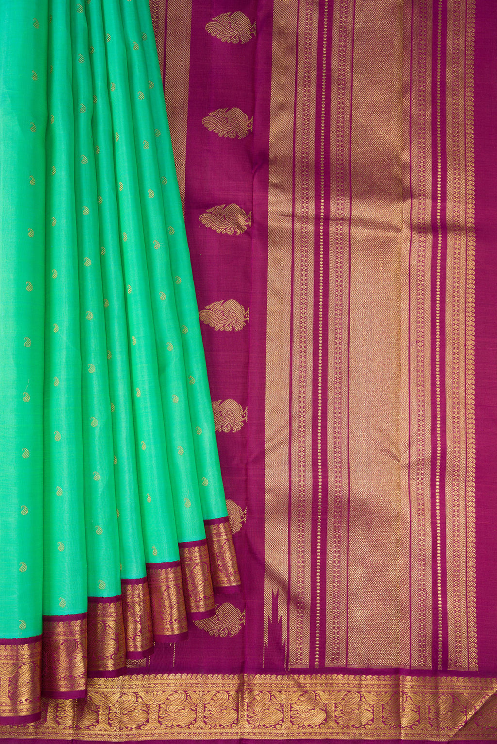 Pleats and pallu of Pure Silk Pure Zari Sea Green Kanjivaram Saree with Zari Butta on the body and Zari Border. 