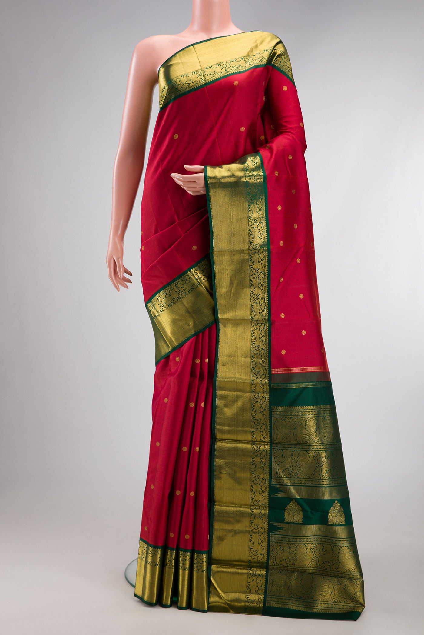 Pure Silk Pure Zari Maroon Kanjivaram Saree with Zari Butta on the body and Zari Border.  displayed on a mannequin