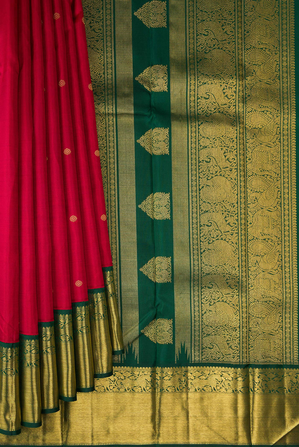 Pleats and pallu of Pure Silk Pure Zari Maroon Kanjivaram Saree with Zari Butta on the body and Zari Border. 