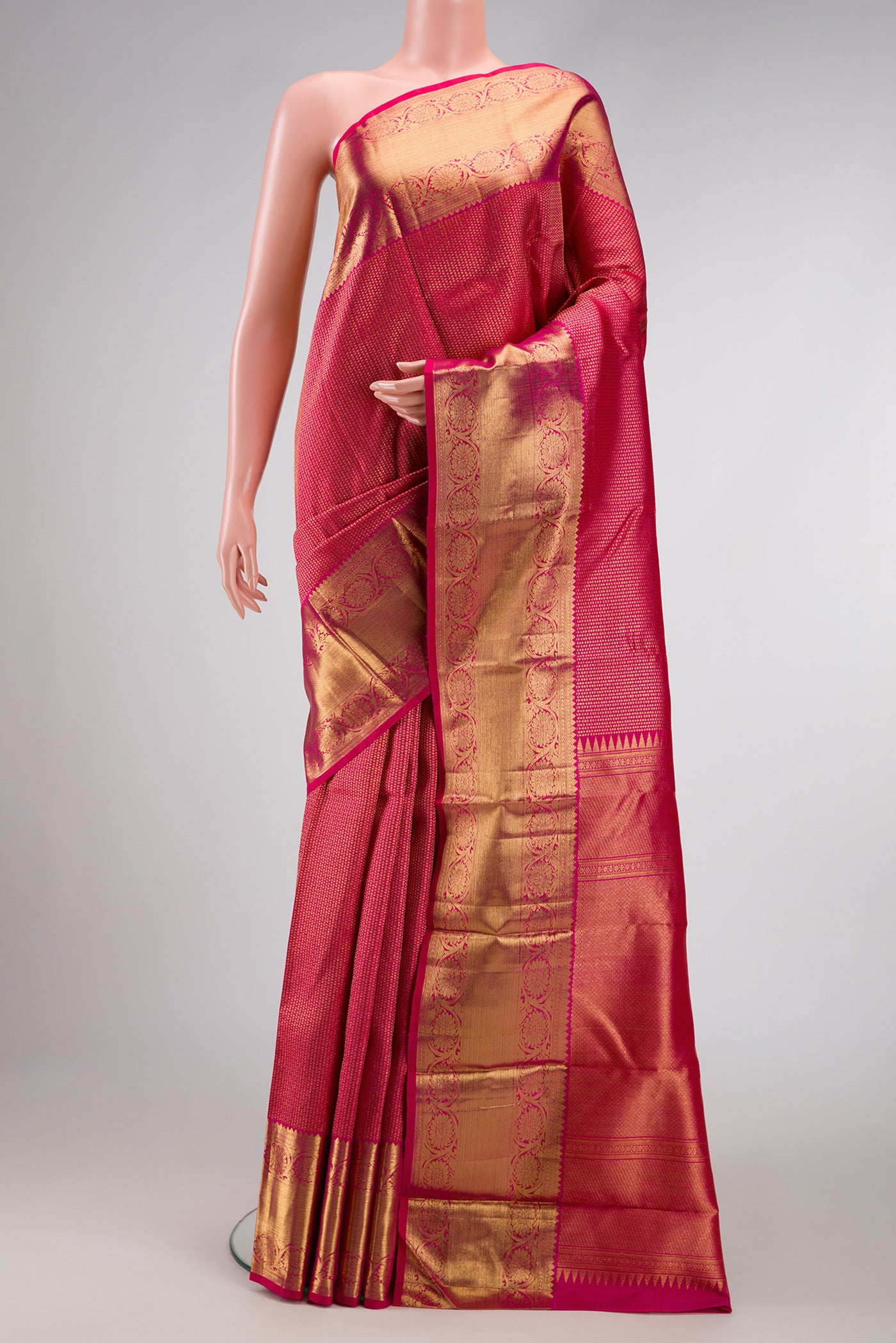 Rani Pink Dual Tone Kanchipuram Silk Saree with Zari Brocade on the body and Zari Border.  displayed on a mannequin
