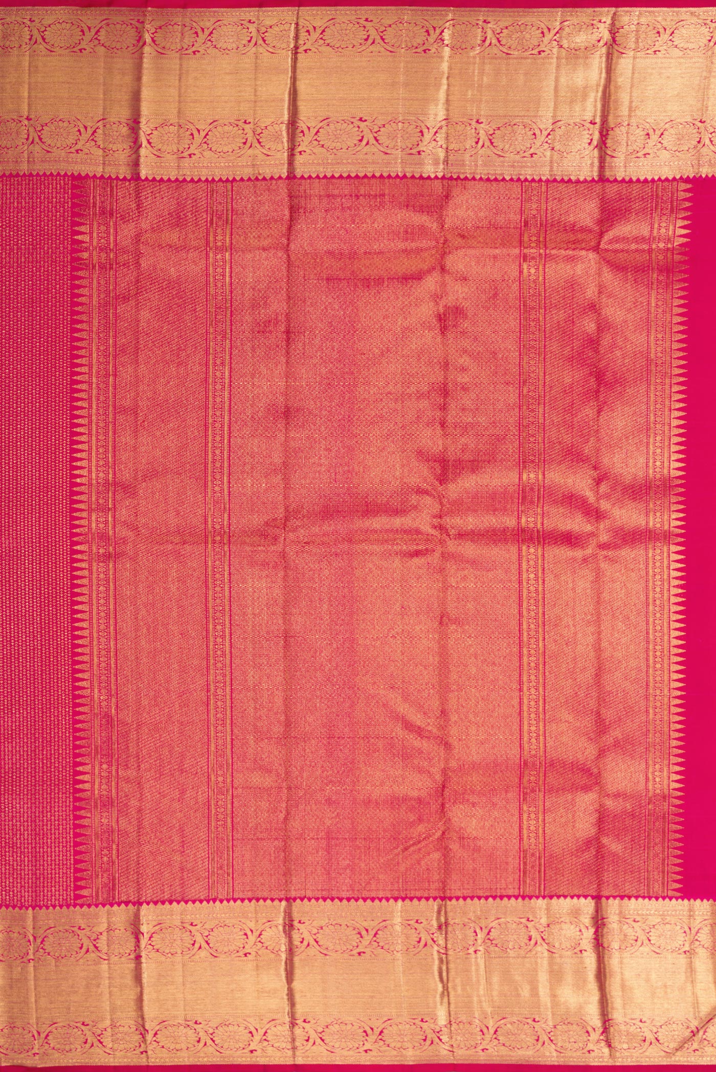 Close up image of the pallu of Rani Pink Dual Tone Kanchipuram Silk Saree with Zari Brocade on the body and Zari Border. 