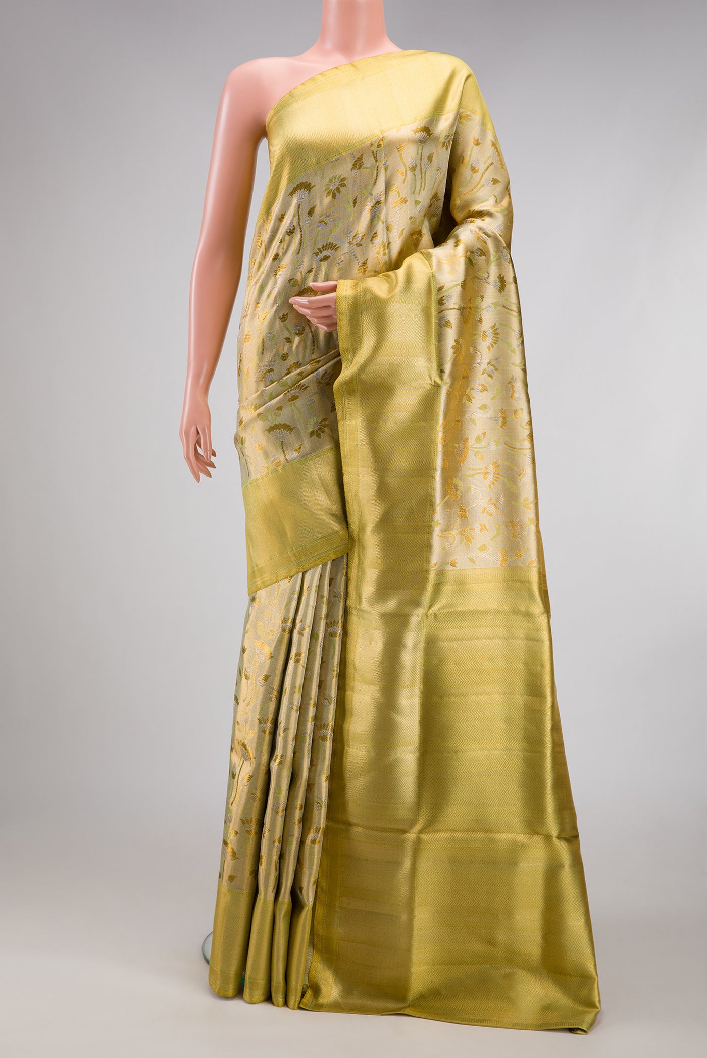 Pista Green Dual Tone Kanjivaram Tissue Silk Saree with Zari Brocade on the body and Zari Border.  displayed on a mannequin