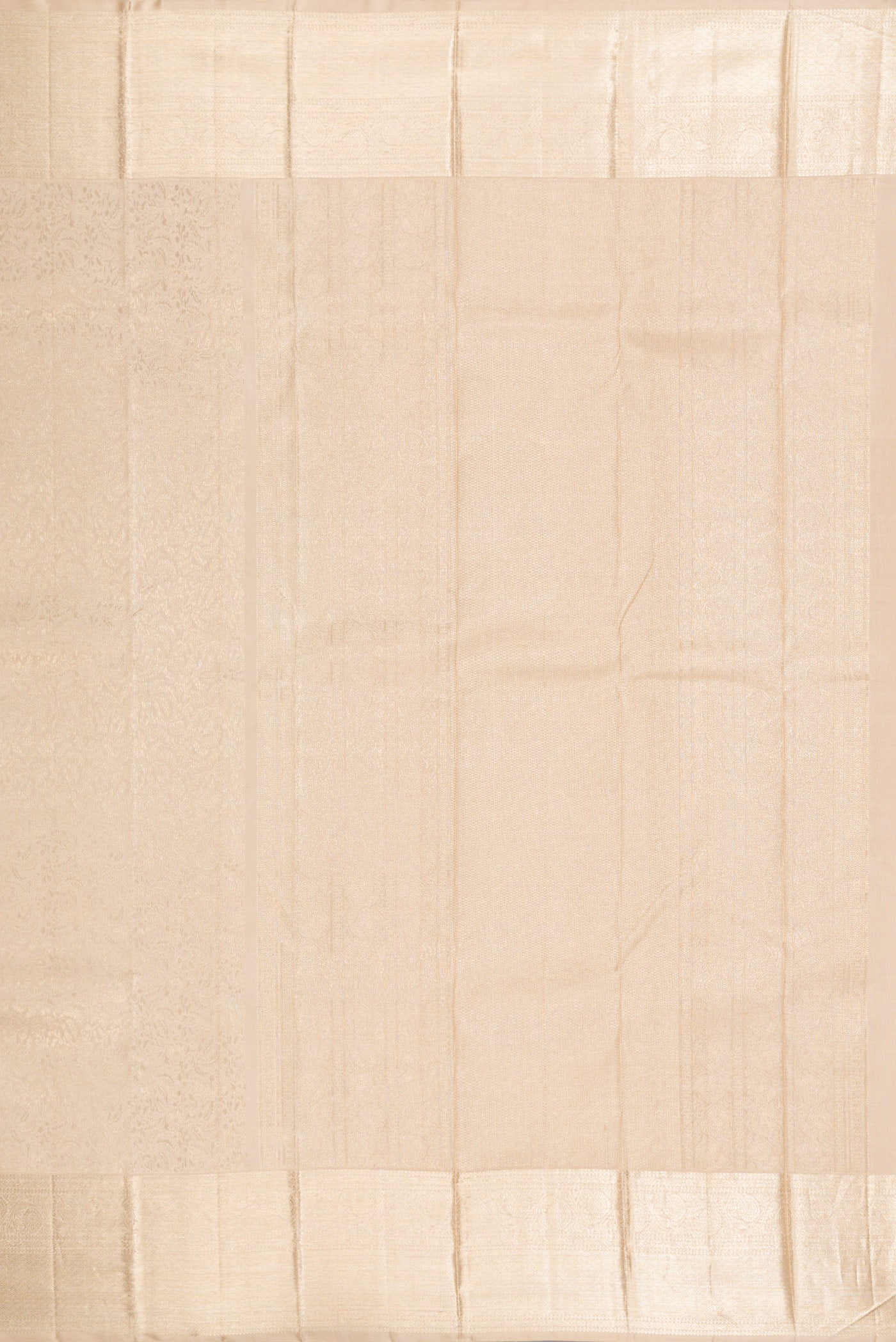Close up image of the pallu of Beige Kanchipuram Silk Saree with Zari Brocade on the body and Zari Border. 