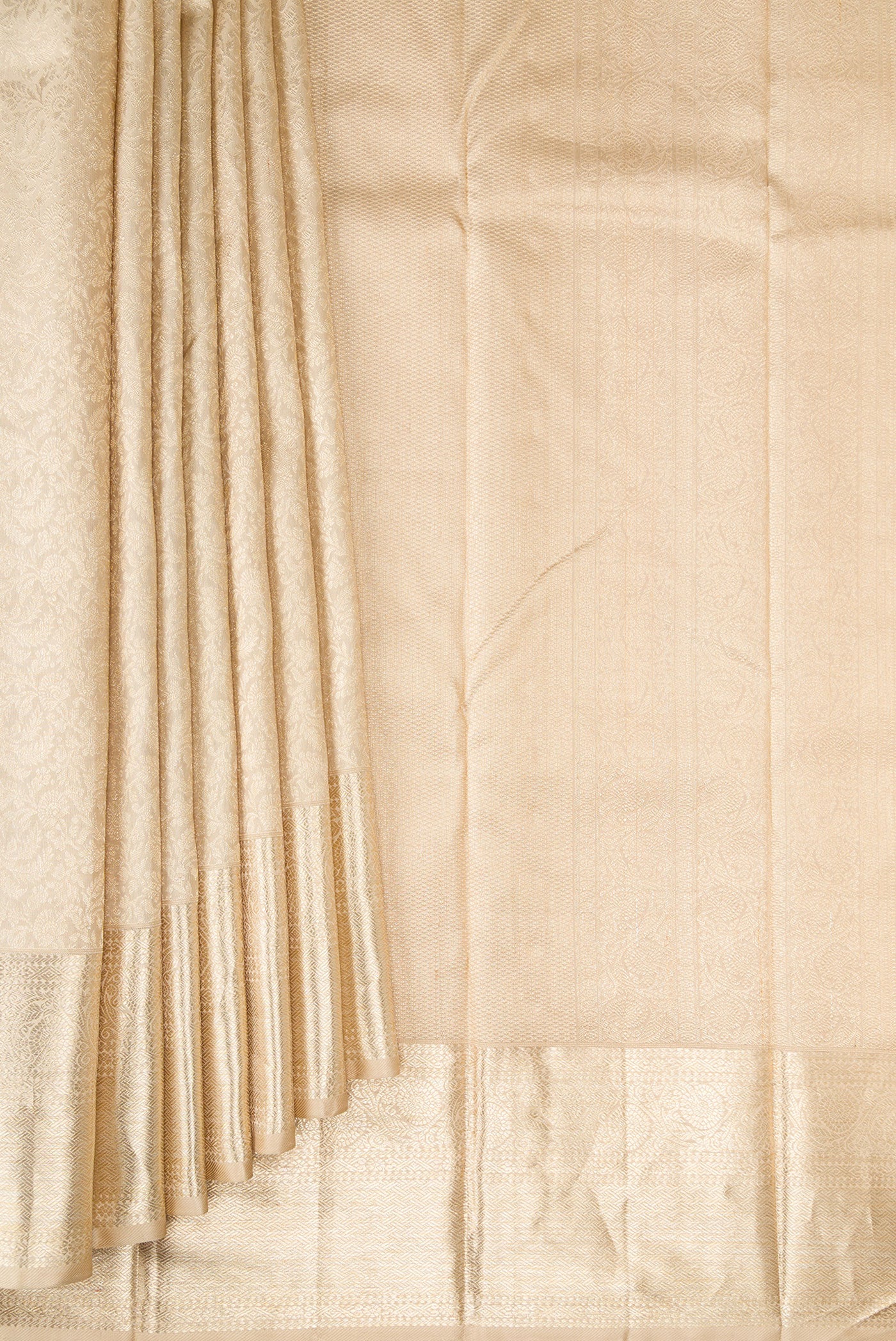 Pleats and pallu of Beige Kanchipuram Silk Saree with Zari Brocade on the body and Zari Border. 
