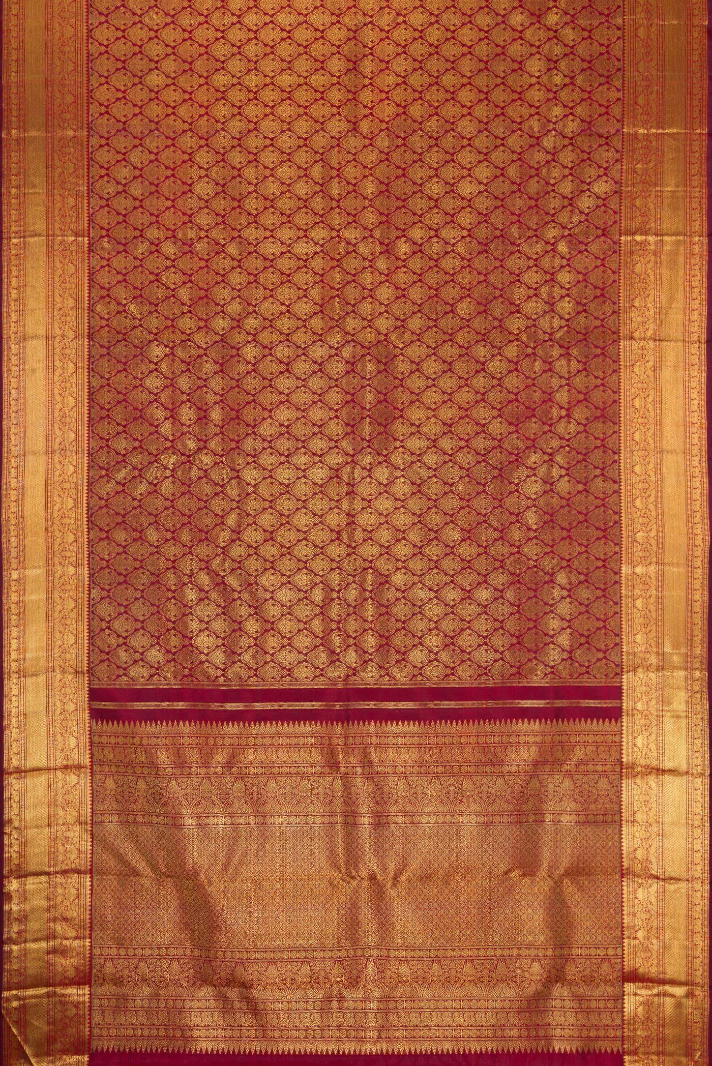 Flat view of Pure Silk Pure Zari Maroon Dual Tone Kanjivaram Saree with Zari Brocade on the body and Zari Border. 
