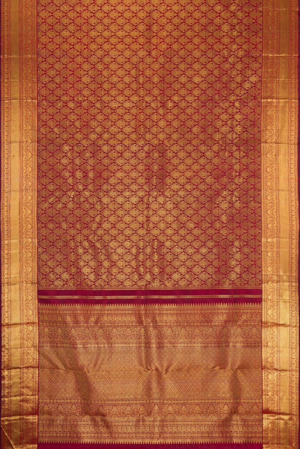 Flat view of Pure Silk Pure Zari Maroon Dual Tone Kanjivaram Saree with Zari Brocade on the body and Zari Border. 