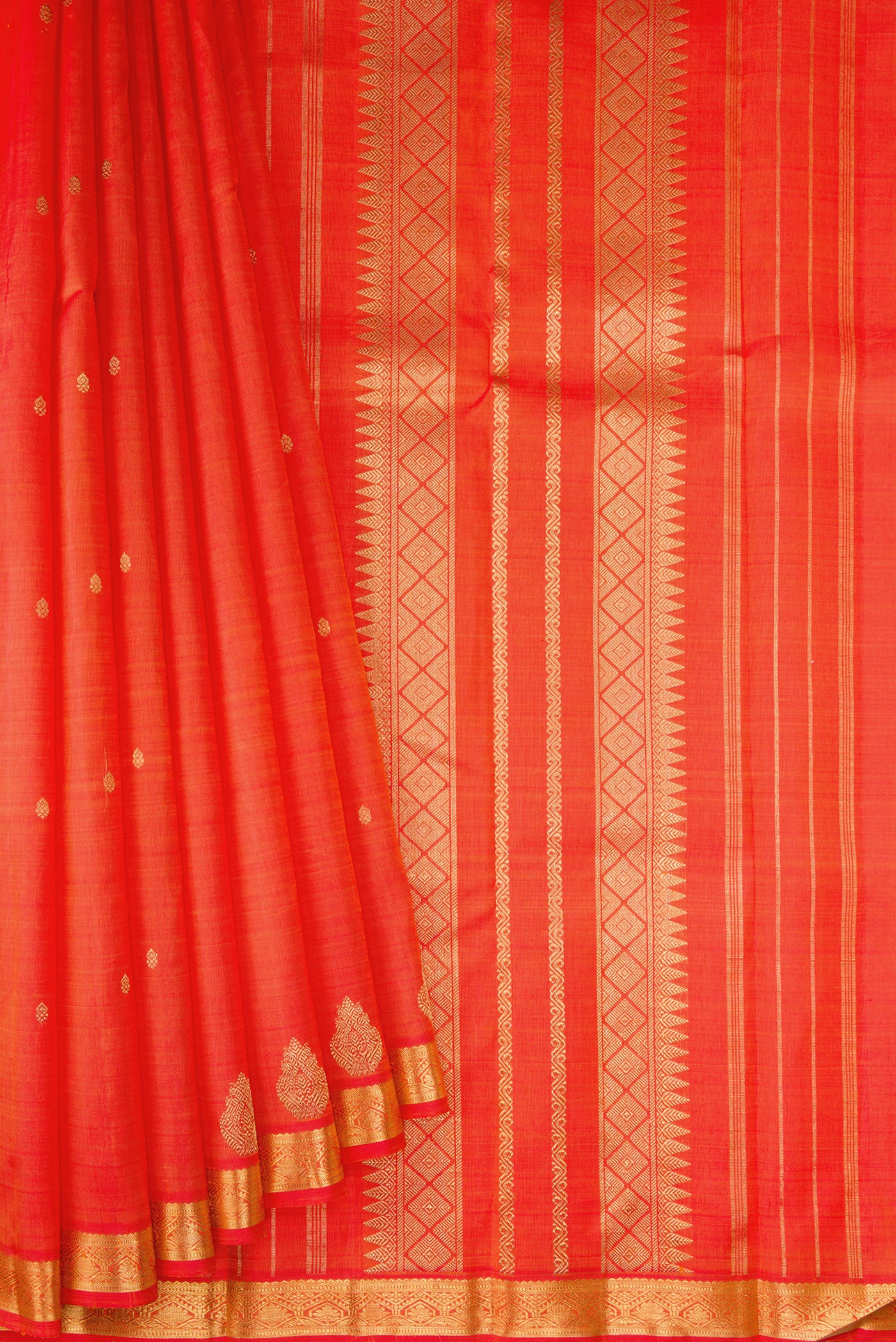 Pleats and pallu of Orange Dual Tone Kanchipuram Silk Saree with Zari Butta on the body and Fancy Border. 