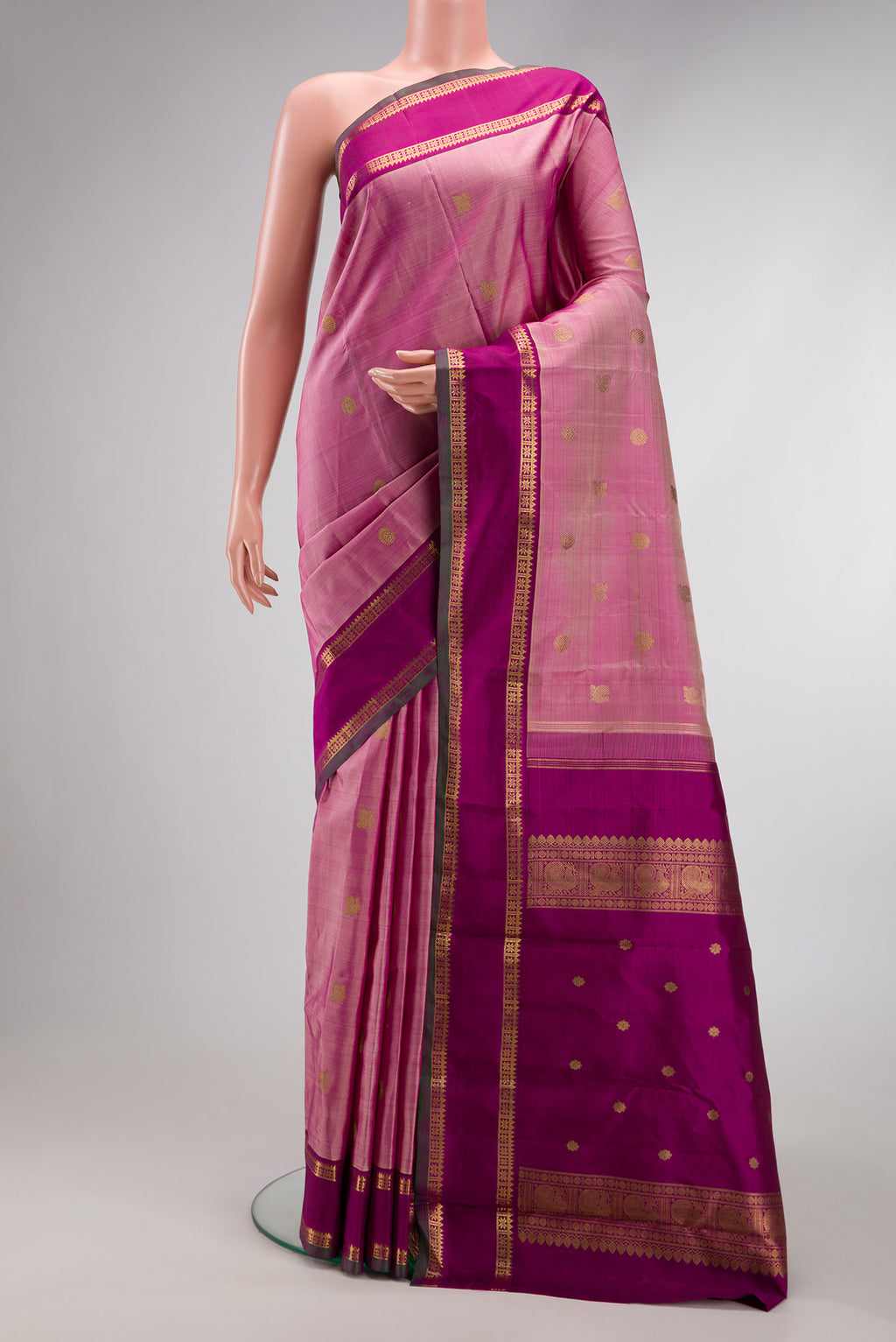 Pink Dual Tone Kanchipuram Silk Saree with Zari Butta on the body and Zari Border.  displayed on a mannequin