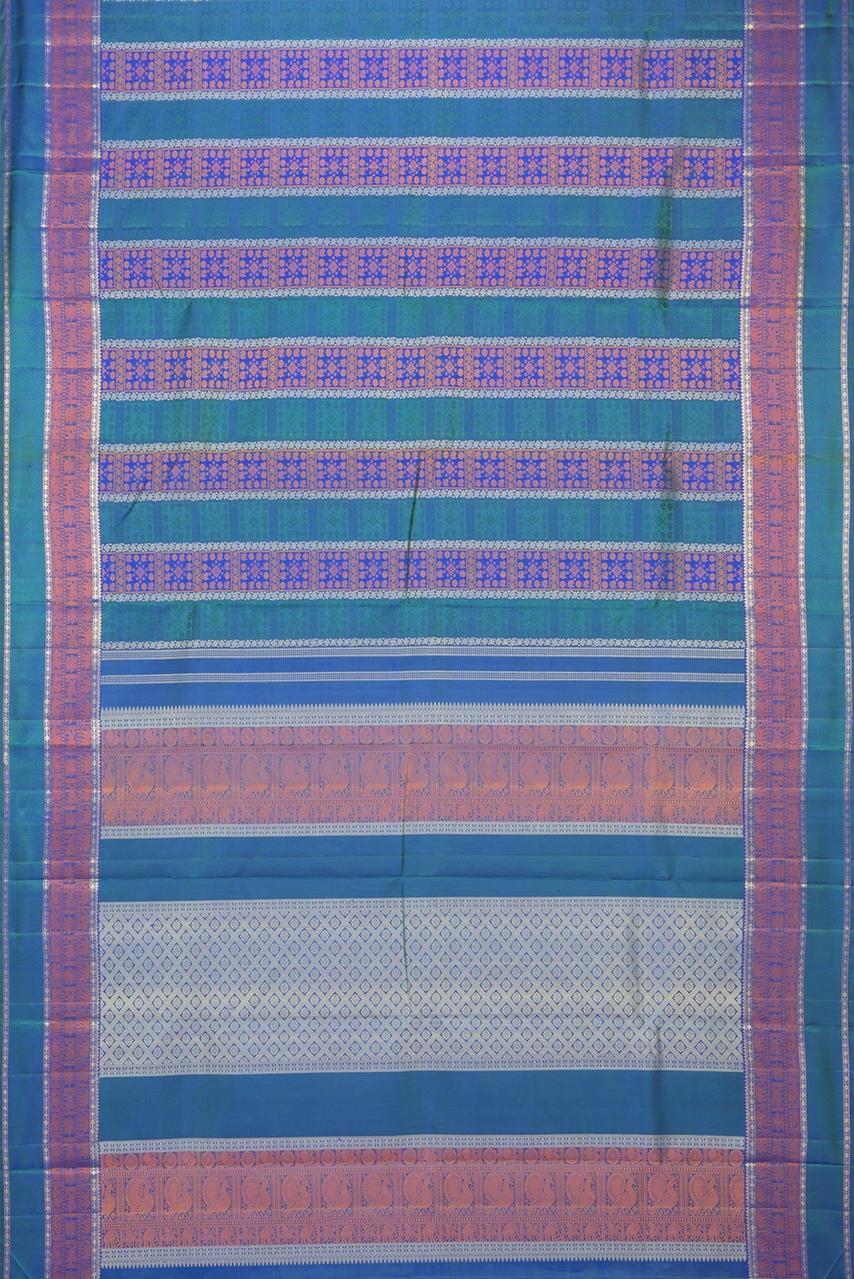 Flat view of Pure Silk Pure Zari Peacock Blue Dual Tone Kanchipuram Saree with Jacquard design on the body and Zari And Thread Border. 