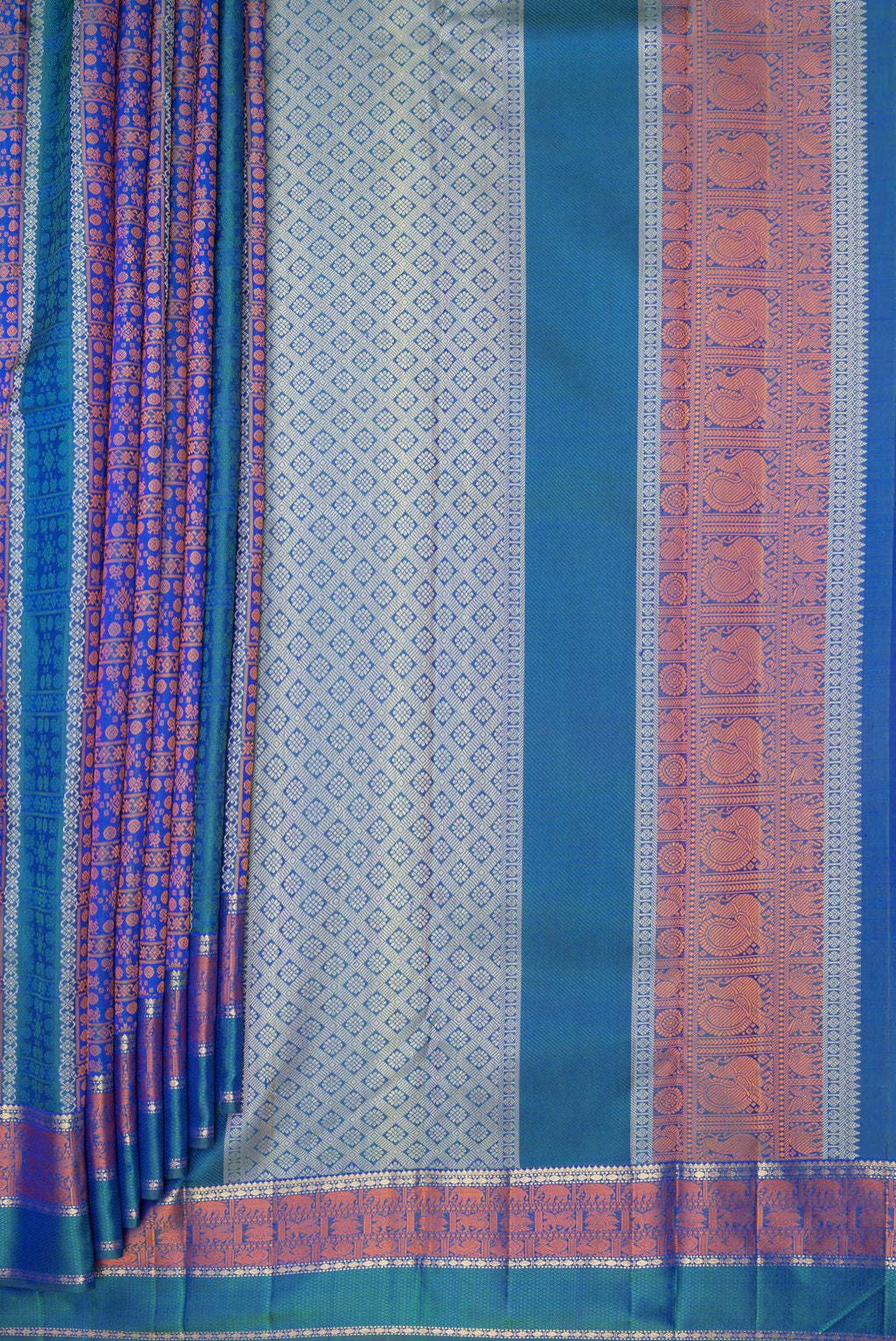 Pleats and pallu of Pure Silk Pure Zari Peacock Blue Dual Tone Kanchipuram Saree with Jacquard design on the body and Zari And Thread Border. 