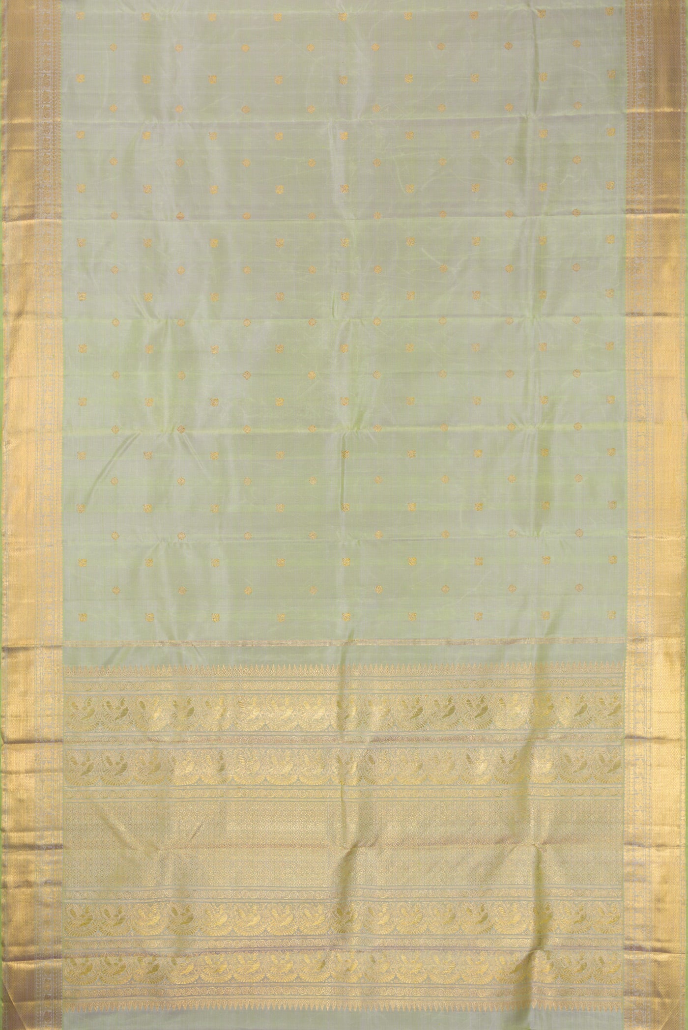 Flat view of Pure Silk Pure Zari Pista Green Dual Tone Kanjivaram Saree with Zari Butta on the body and Zari Border. 