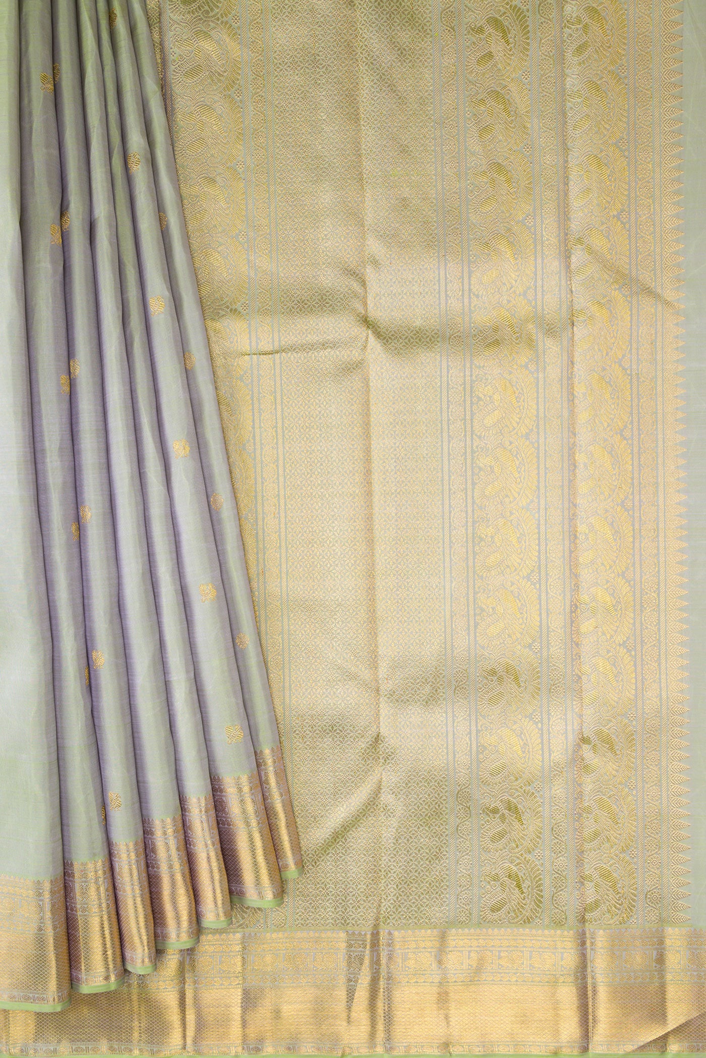 Pleats and pallu of Pure Silk Pure Zari Pista Green Dual Tone Kanjivaram Saree with Zari Butta on the body and Zari Border. 