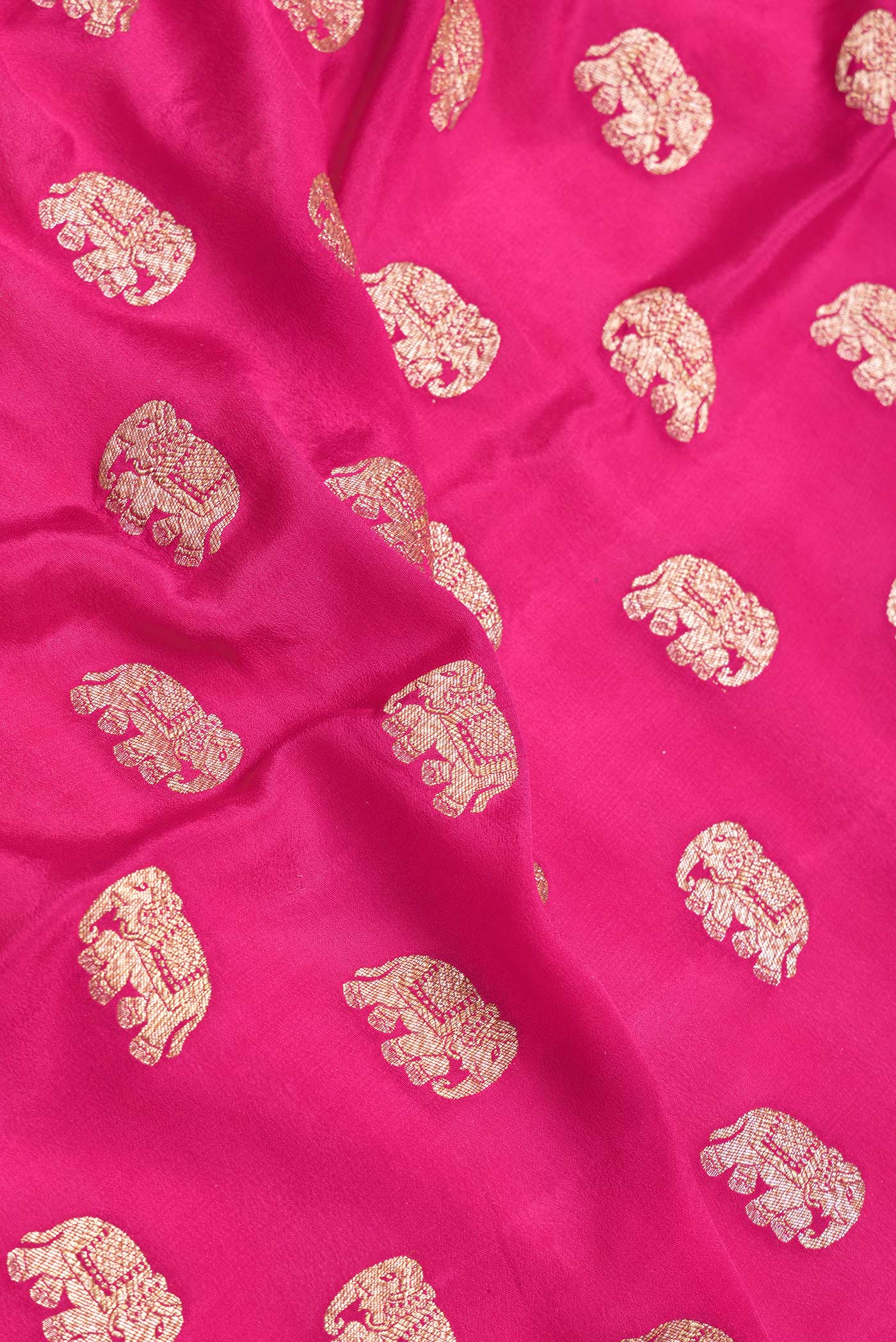 Close up of Pink Dual Tone Banarasi Georgette Saree with Zari Butta on the body and Zari Border.  displaying folds