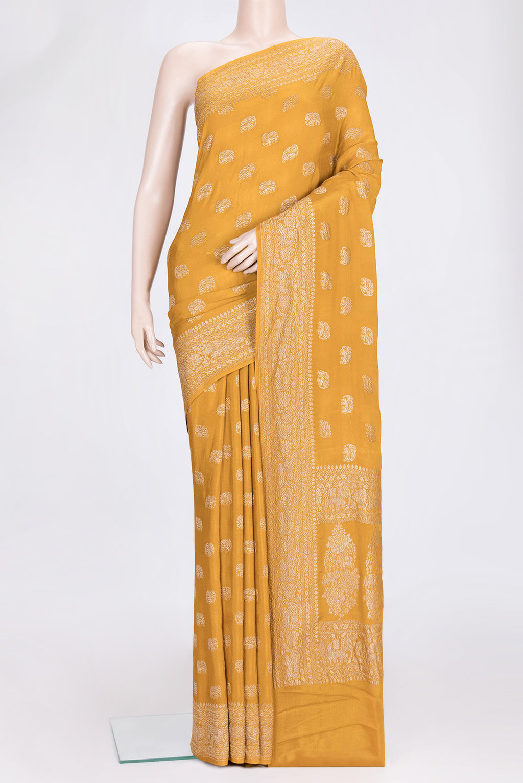 Mustard Dual Tone Banarasi Georgette Saree with Zari Butta on the body and Zari Border.  displayed on a mannequin
