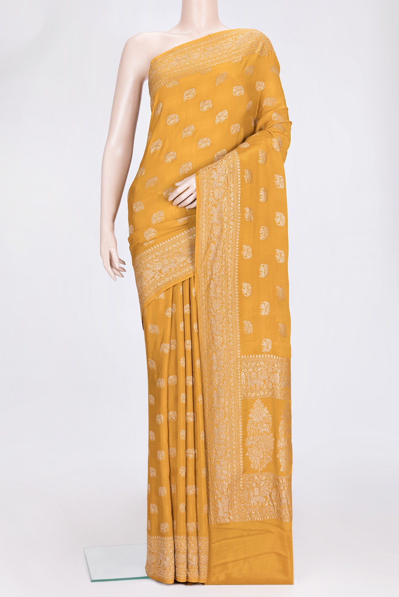 Mustard Dual Tone Banarasi Georgette Saree with Zari Butta on the body and Zari Border.  displayed on a mannequin