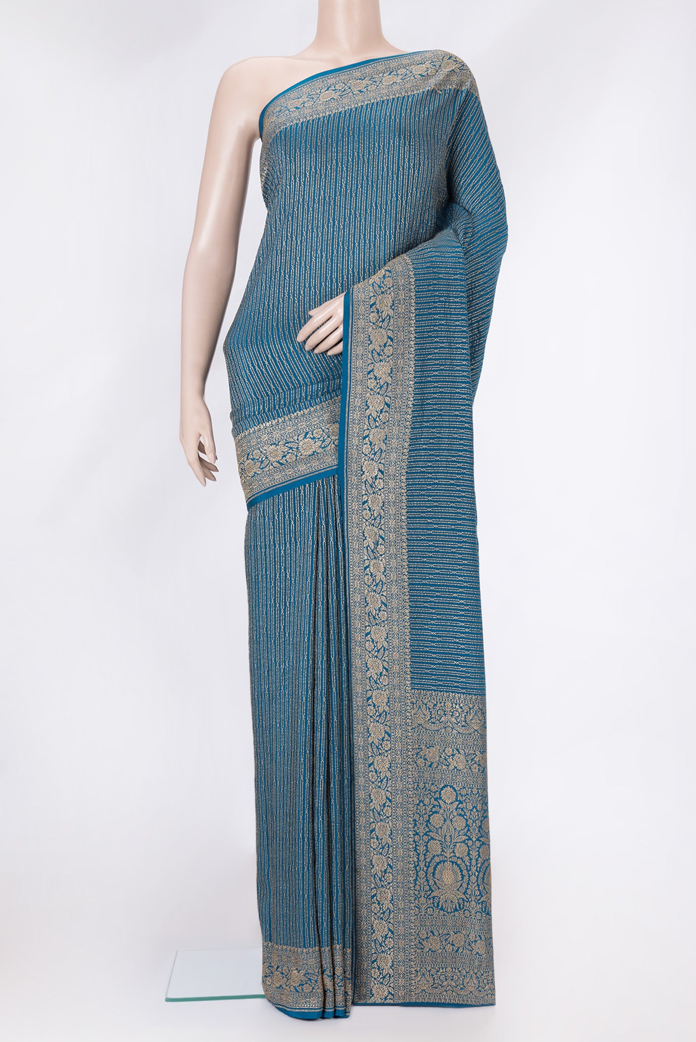 Peacock Blue Dual Tone Banarasi Georgette Saree with Zari Brocade on the body and Zari Border.  displayed on a mannequin