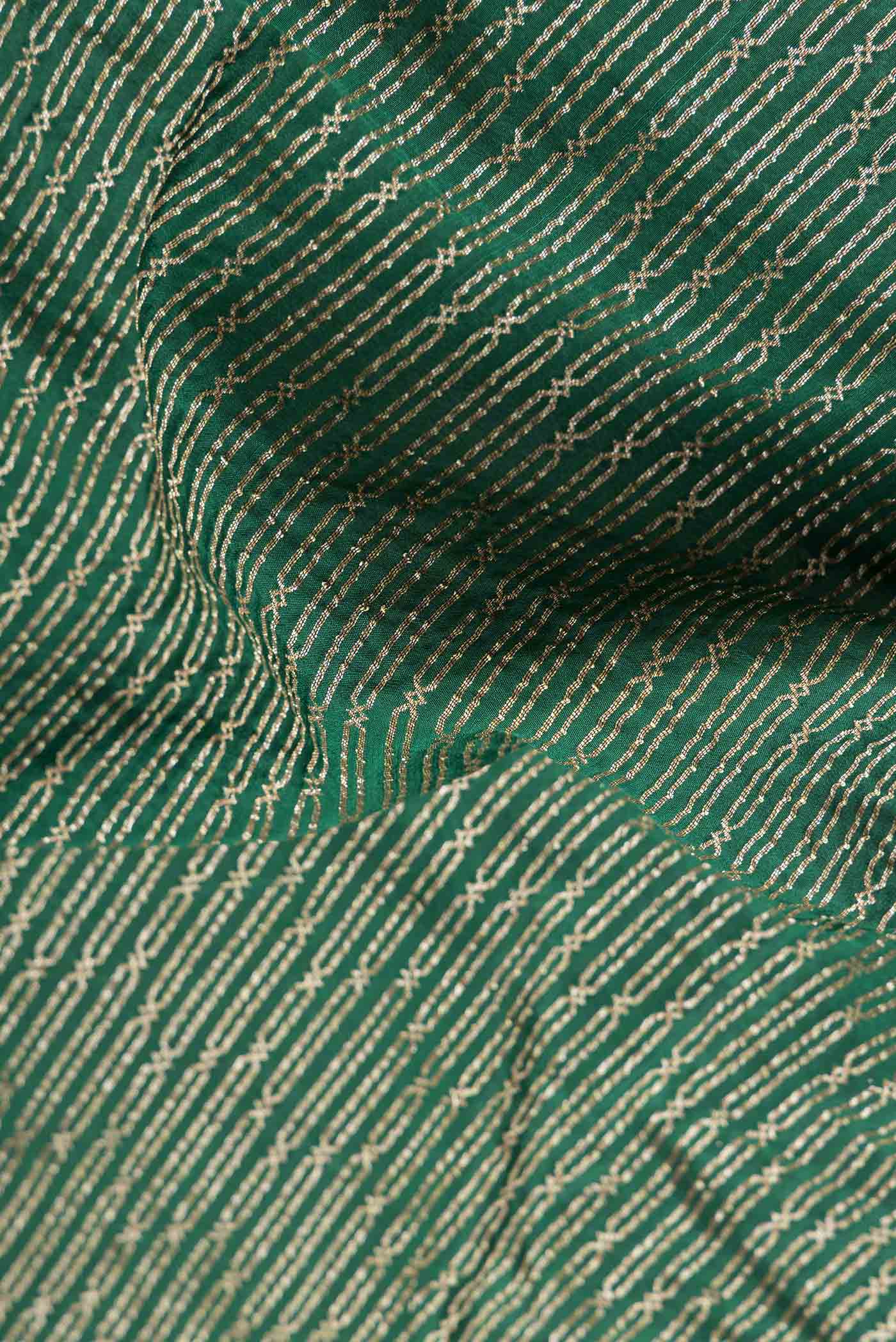 Close up of Green Dual Tone Banarasi Georgette Saree with Zari Brocade on the body and Zari Border.  displaying folds