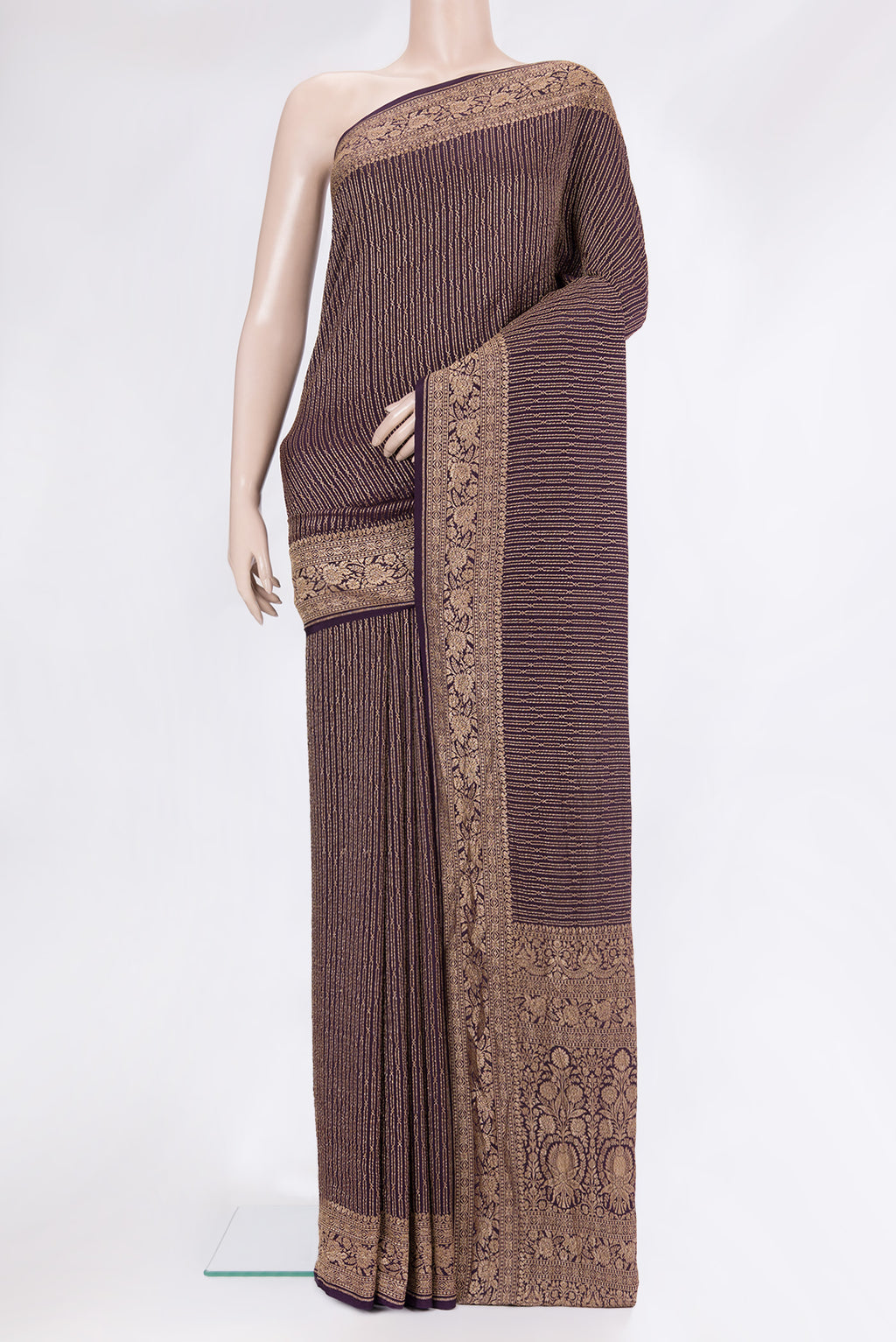 Burgundy Banarasi Georgette Saree with Zari Brocade on the body and Fancy Border.  displayed on a mannequin