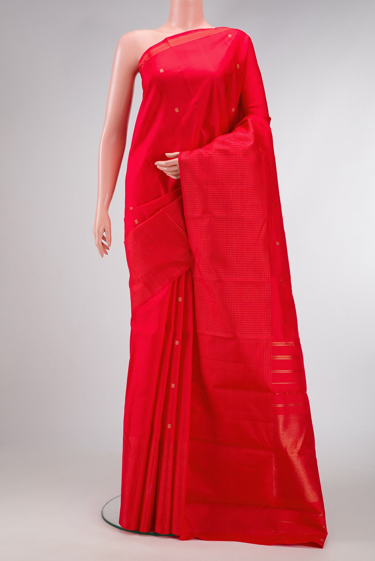 Red Dual Tone Kanjivaram Silk Saree with Zari Butta on the body and Checks Border.  displayed on a mannequin