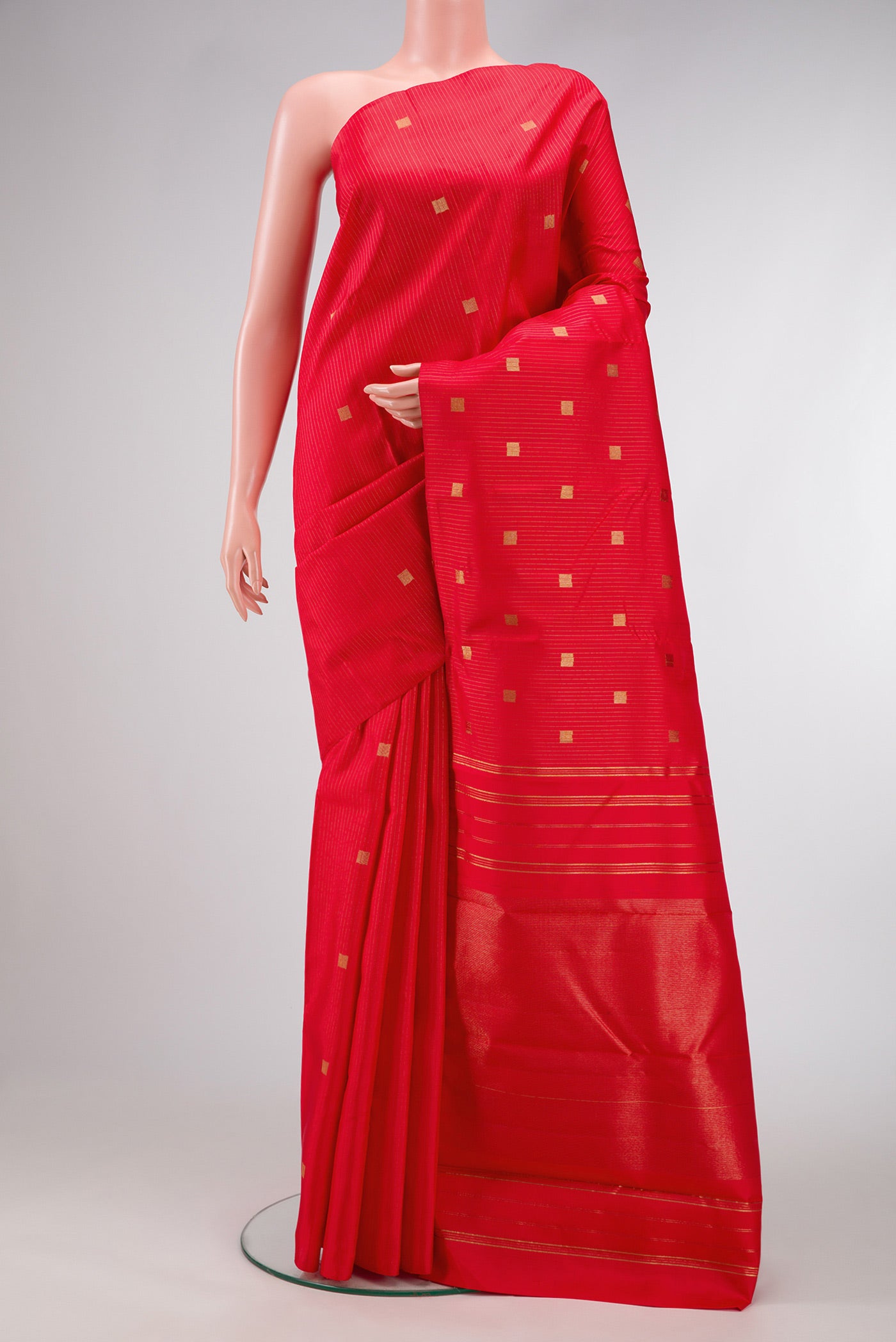 Pure Silk Pure Zari Red Dual Tone Kanchipuram Saree with Zari Butta on the body and Without Border.  displayed on a mannequin