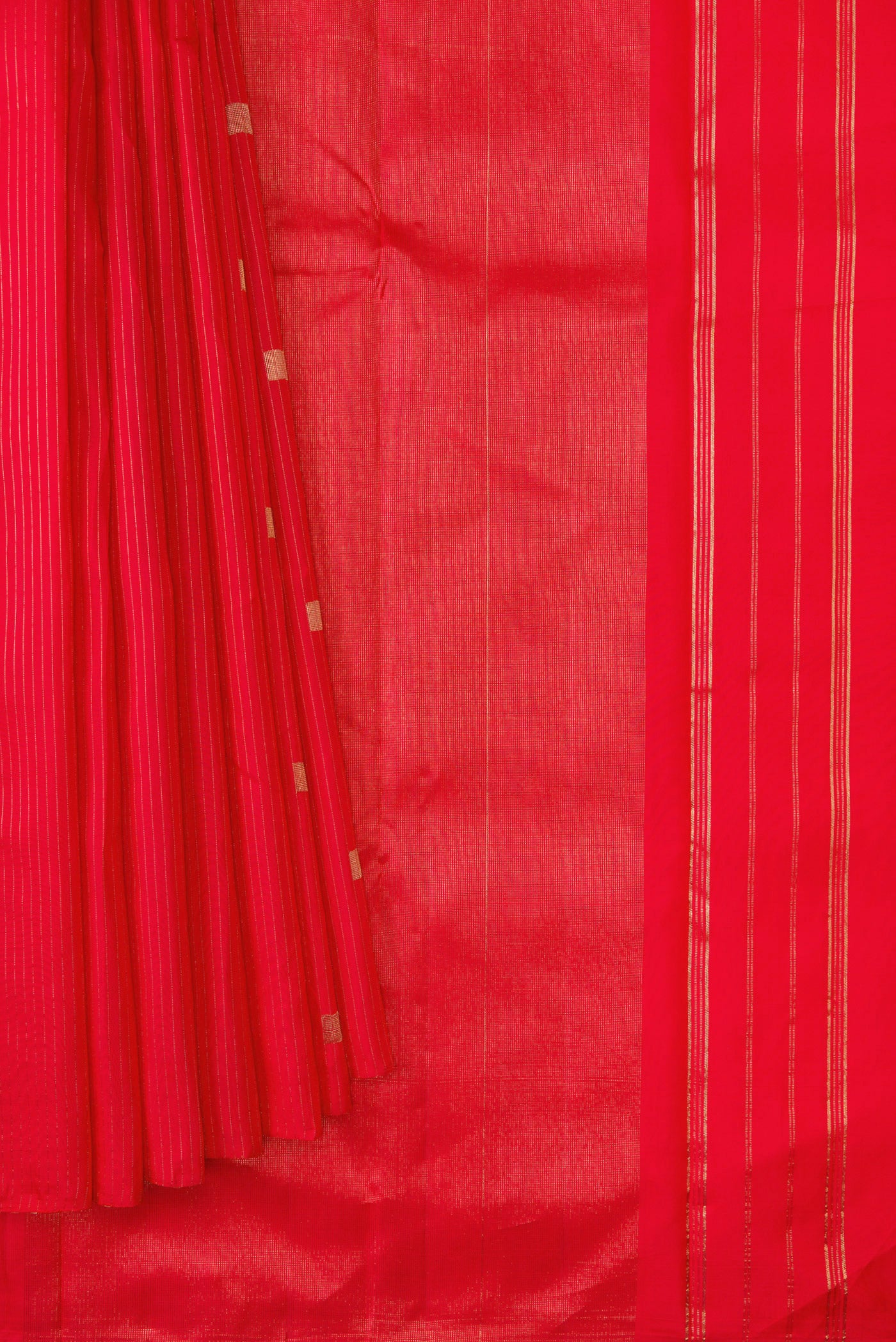 Pleats and pallu of Pure Silk Pure Zari Red Dual Tone Kanchipuram Saree with Zari Butta on the body and Without Border. 