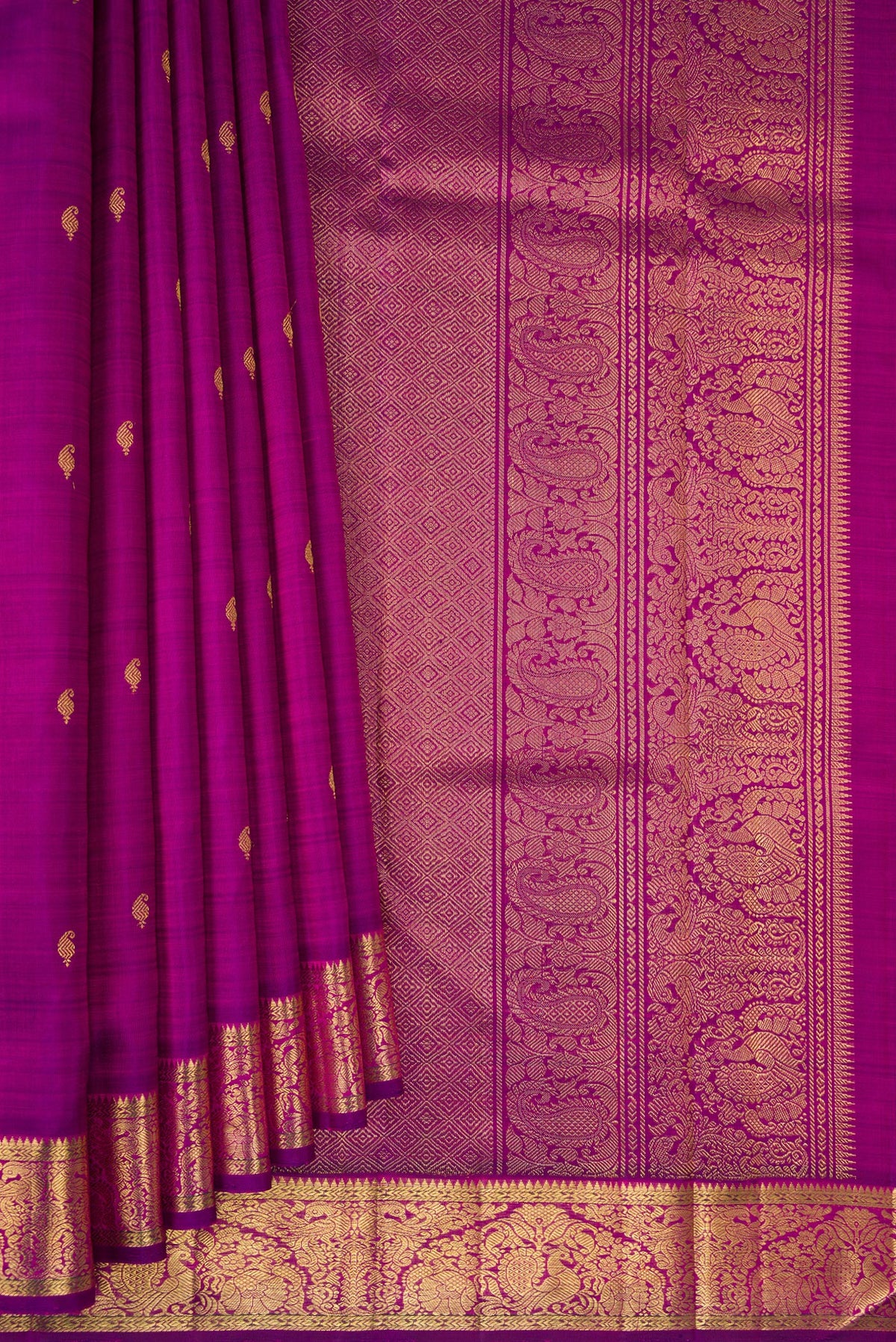 Pleats and pallu of Pure Silk Pure Zari Purple Kanchipuram Saree with Zari Butta on the body and Zari Border. 