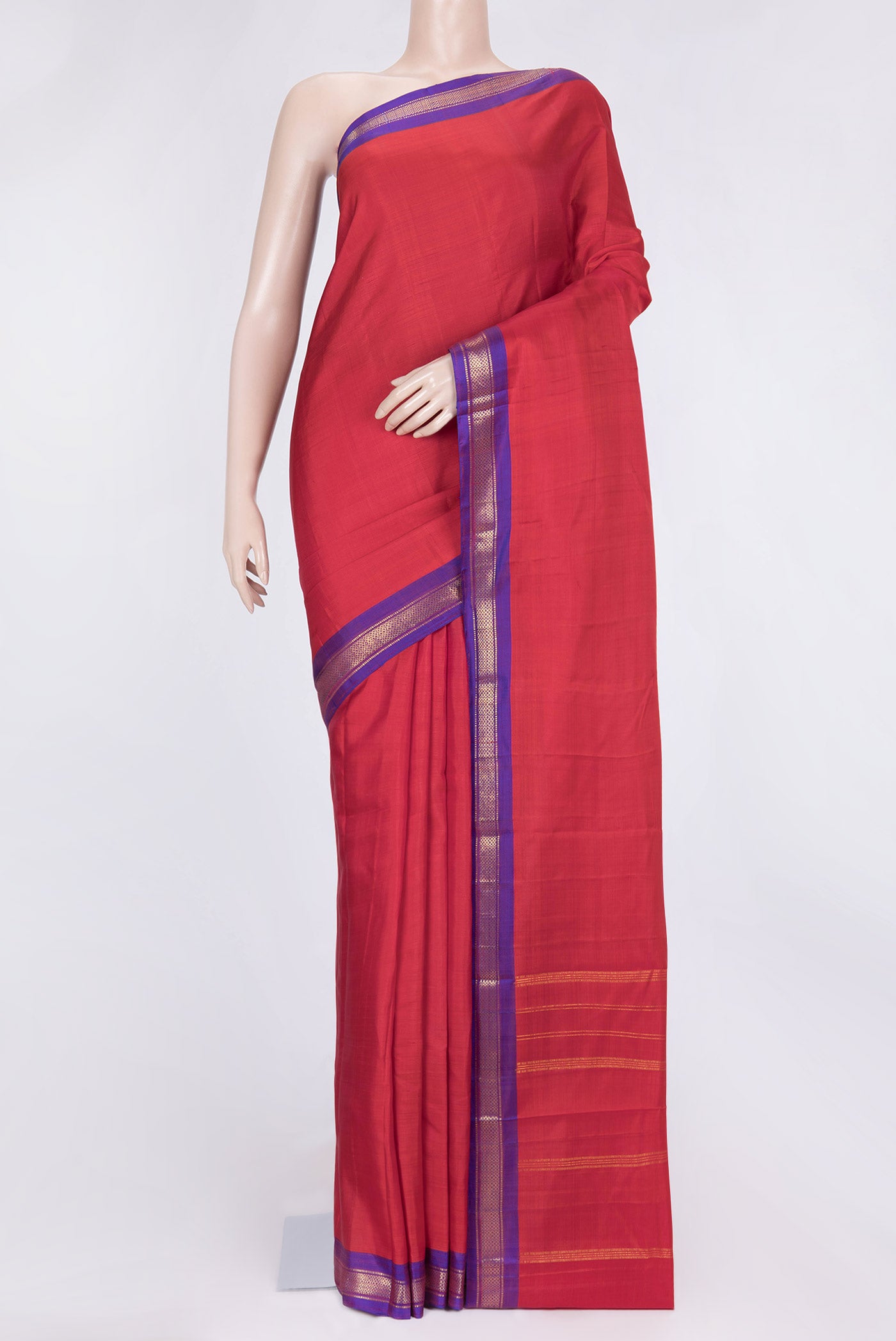 Red Dual Tone Kanchipuram Saree with Plain Body and Zari Border.  displayed on a mannequin