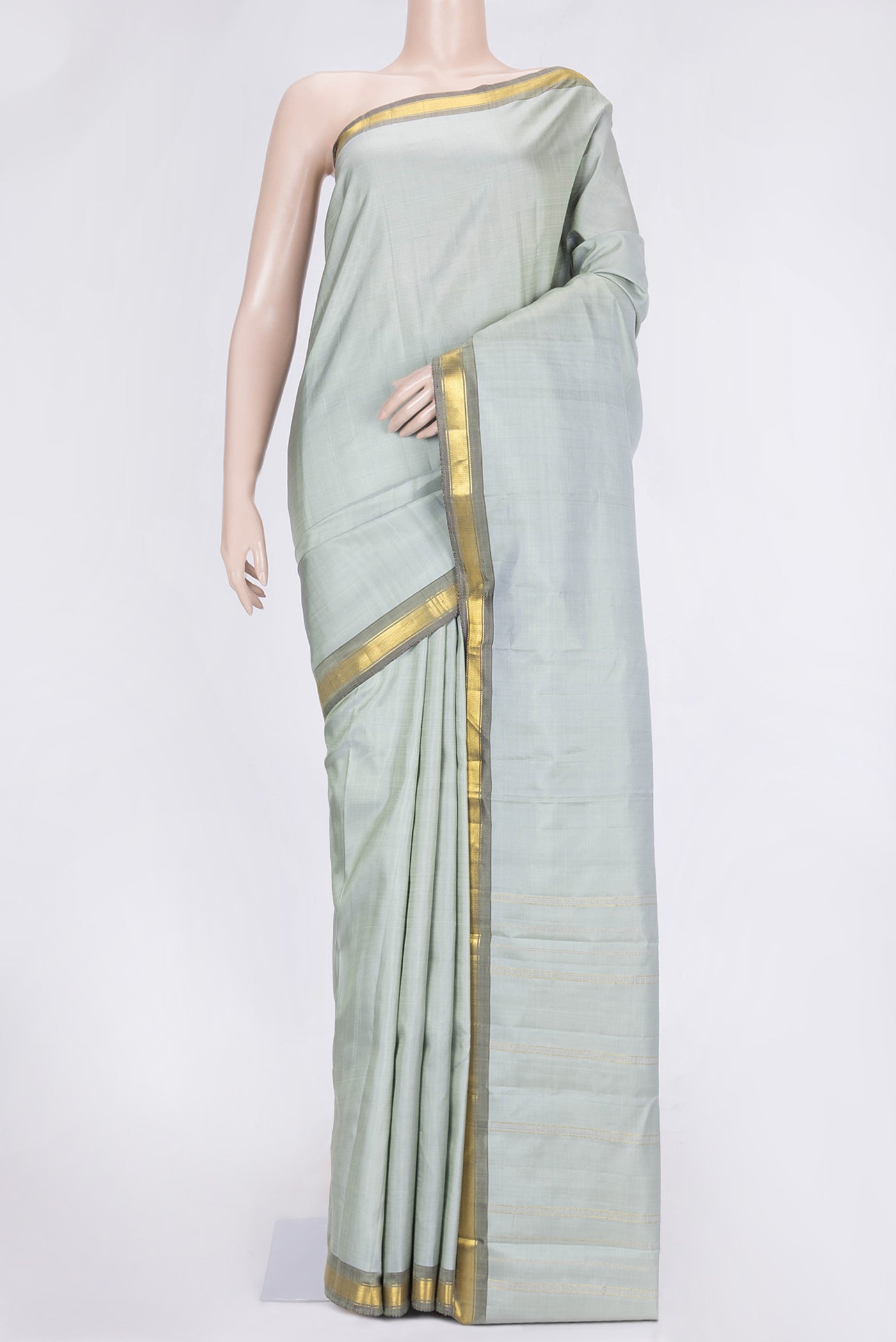 Grey Dual Tone Kanchipuram Saree with Plain Body and Zari Border.  displayed on a mannequin