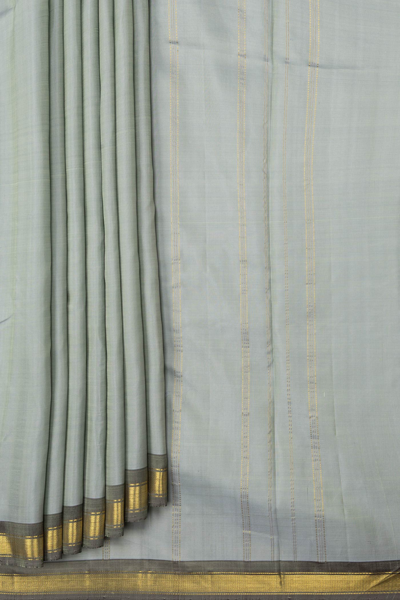 Pleats and pallu of Grey Dual Tone Kanchipuram Saree with Plain Body and Zari Border. 