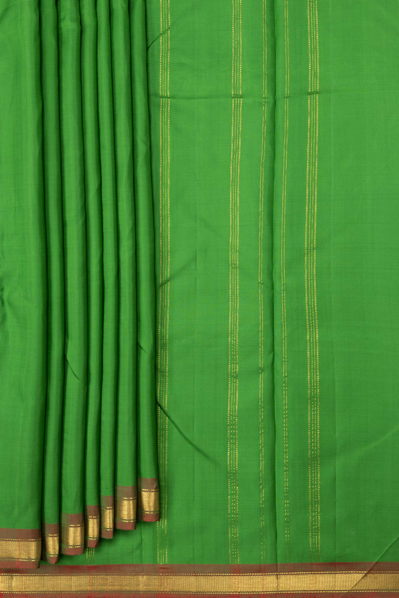 Pleats and pallu of Parrot Green Dual Tone Kanchipuram Saree with Plain Body and Zari Border. 