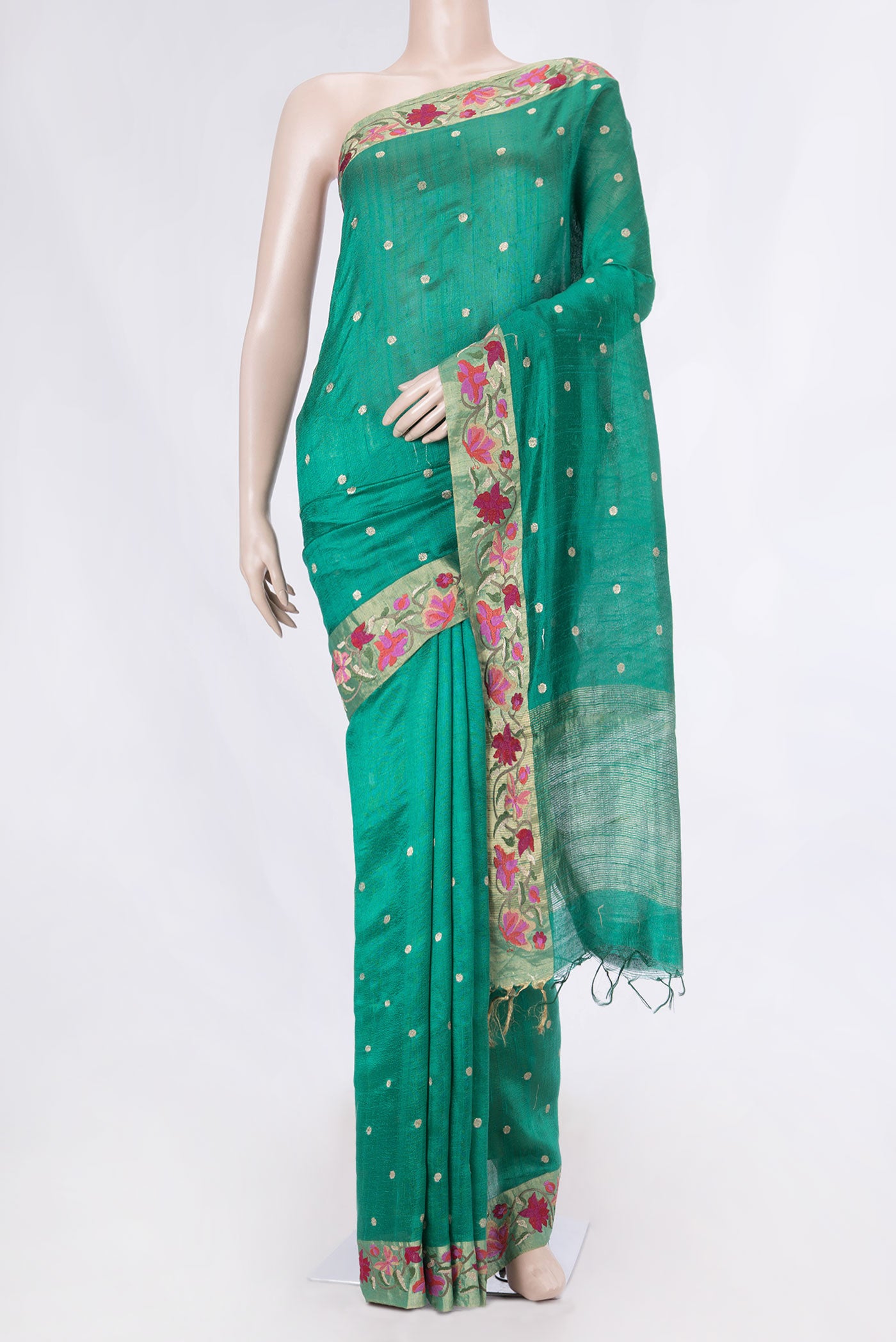 Green Tussar Silk Saree with Embroidery on the body and Embroidery Border displayed on a mannequin
