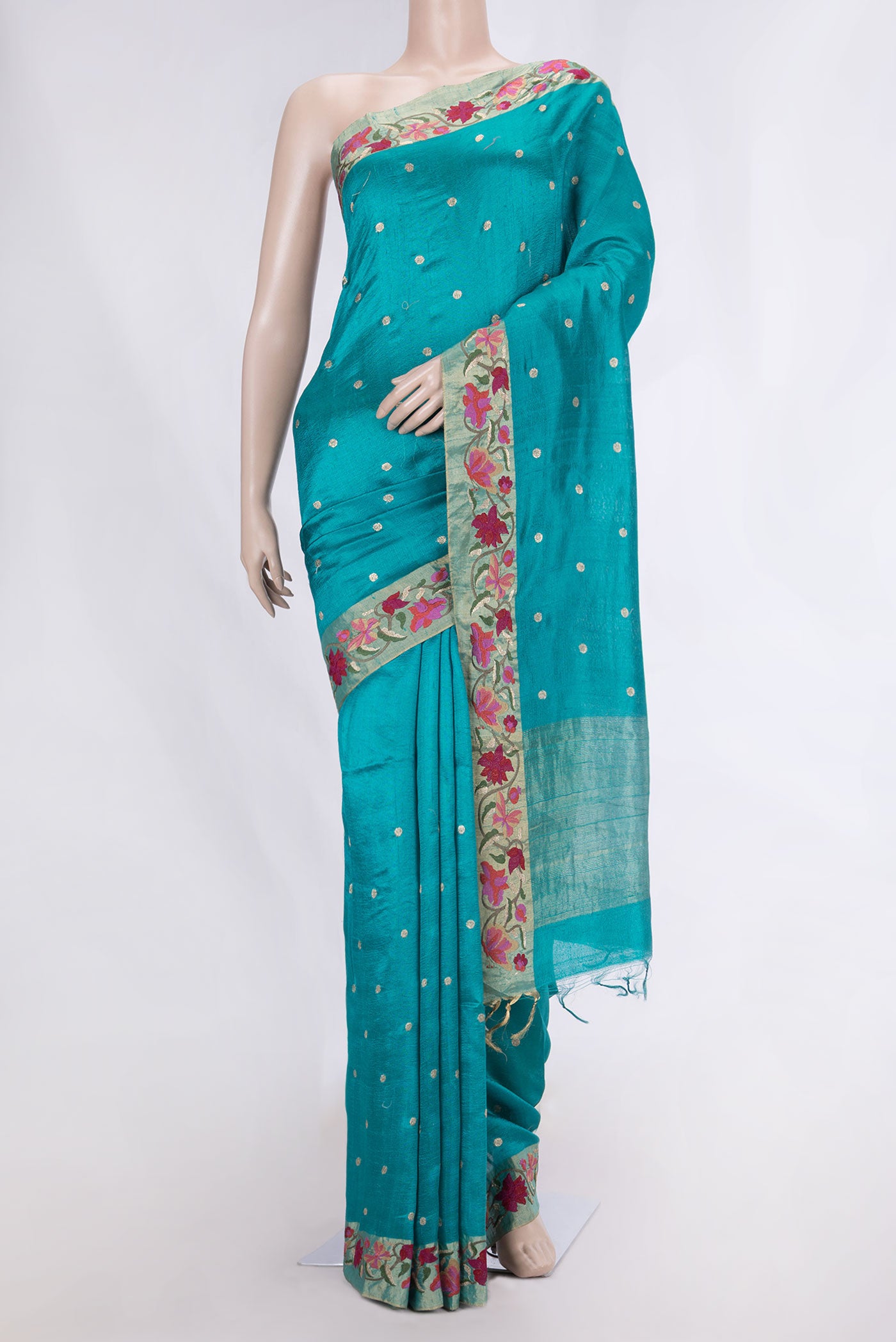 Blue Tussar Silk Saree with Embroidery on the body and Embroidery Border displayed on a mannequin