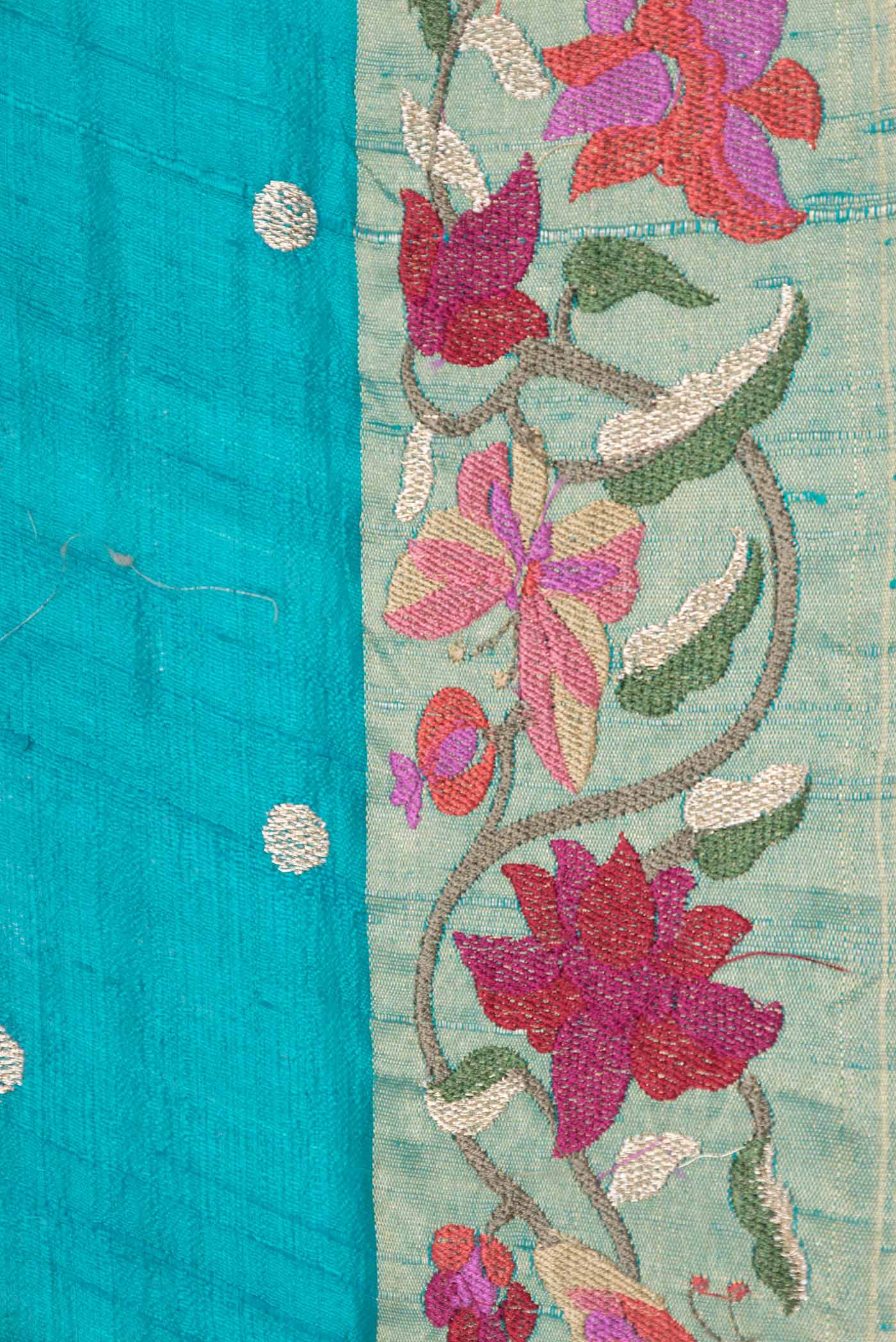 Border image of Sky Blue Dual Tone Tussar Saree with Zari Butta on the body and Embroidery Border