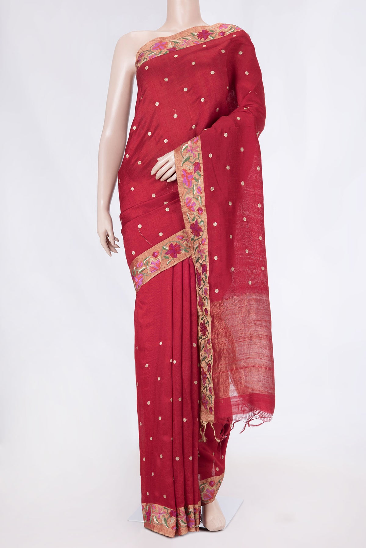 Red Tussar Silk Saree with Embroidery on the body and Embroidery Border displayed on a mannequin
