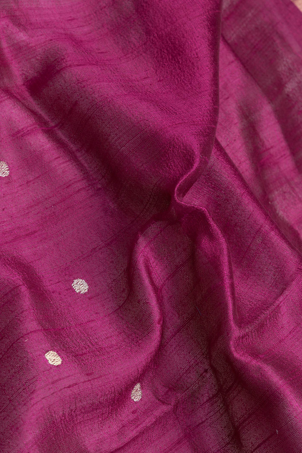 Close up of Purple Dual Tone Tussar Silk Saree with Zari Butta on the body and Zari And Thread Border.  displaying folds