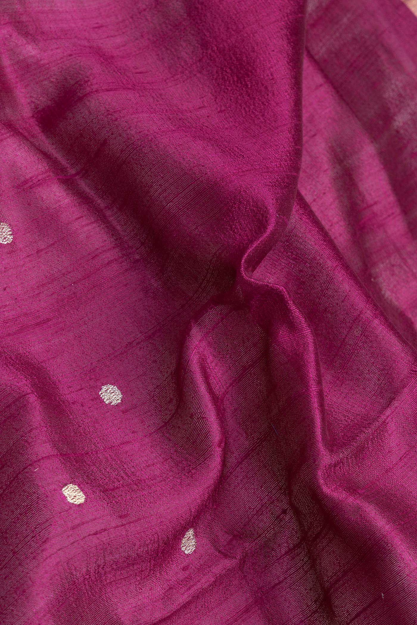 Close up of Purple Dual Tone Tussar Silk Saree with Zari Butta on the body and Zari And Thread Border.  displaying folds