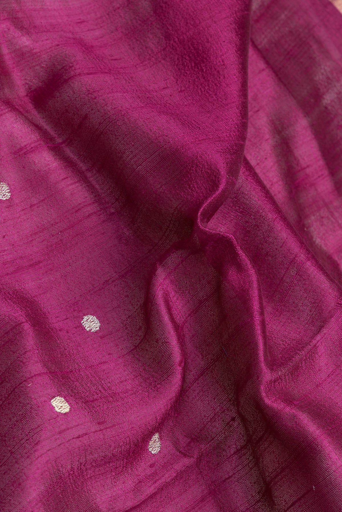 Close up of Purple Dual Tone Tussar Silk Saree with Zari Butta on the body and Zari And Thread Border.  displaying folds