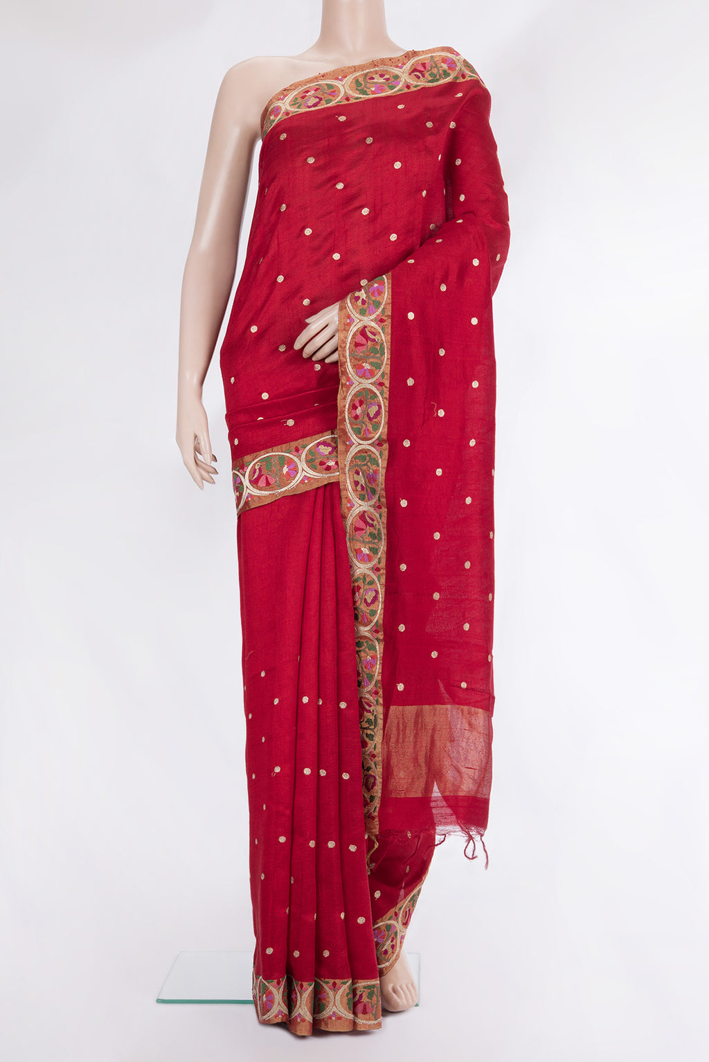 Pure Silk Red Tussar Saree with Zari Butta on the body and Embroidery Border.  displayed on a mannequin