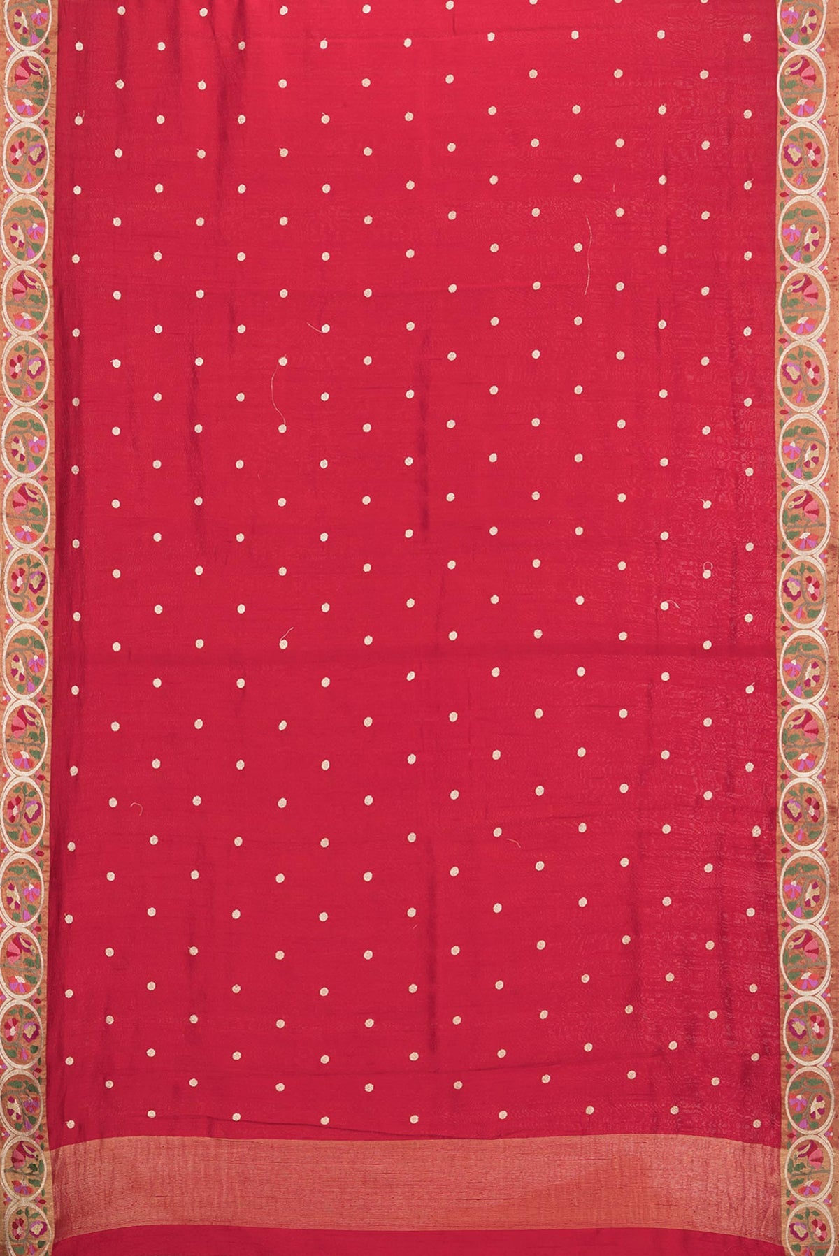 Flat view of Pure Silk Red Tussar Saree with Zari Butta on the body and Embroidery Border. 