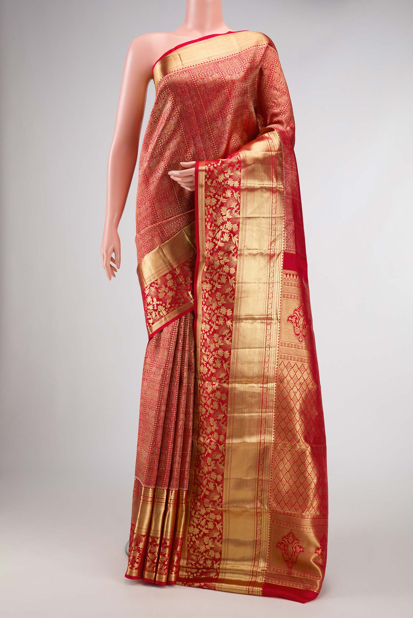 Red Dual Tone Kanchipuram Silk Saree with Zari Brocade on the body and Zari Border.  displayed on a mannequin