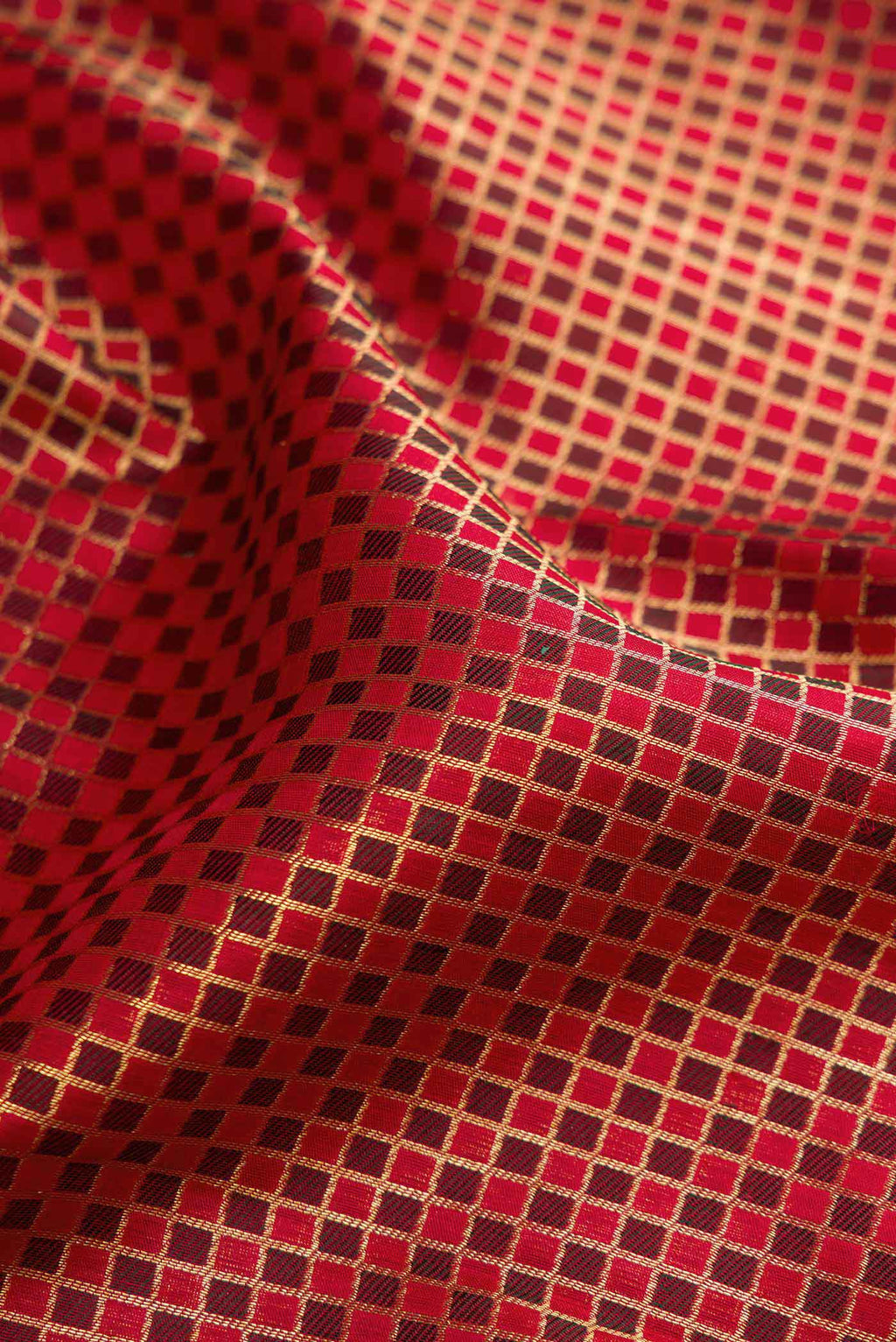 Close up of Red Dual Tone Kanchipuram Silk Saree with Zari Brocade on the body and Zari Border.  displaying folds