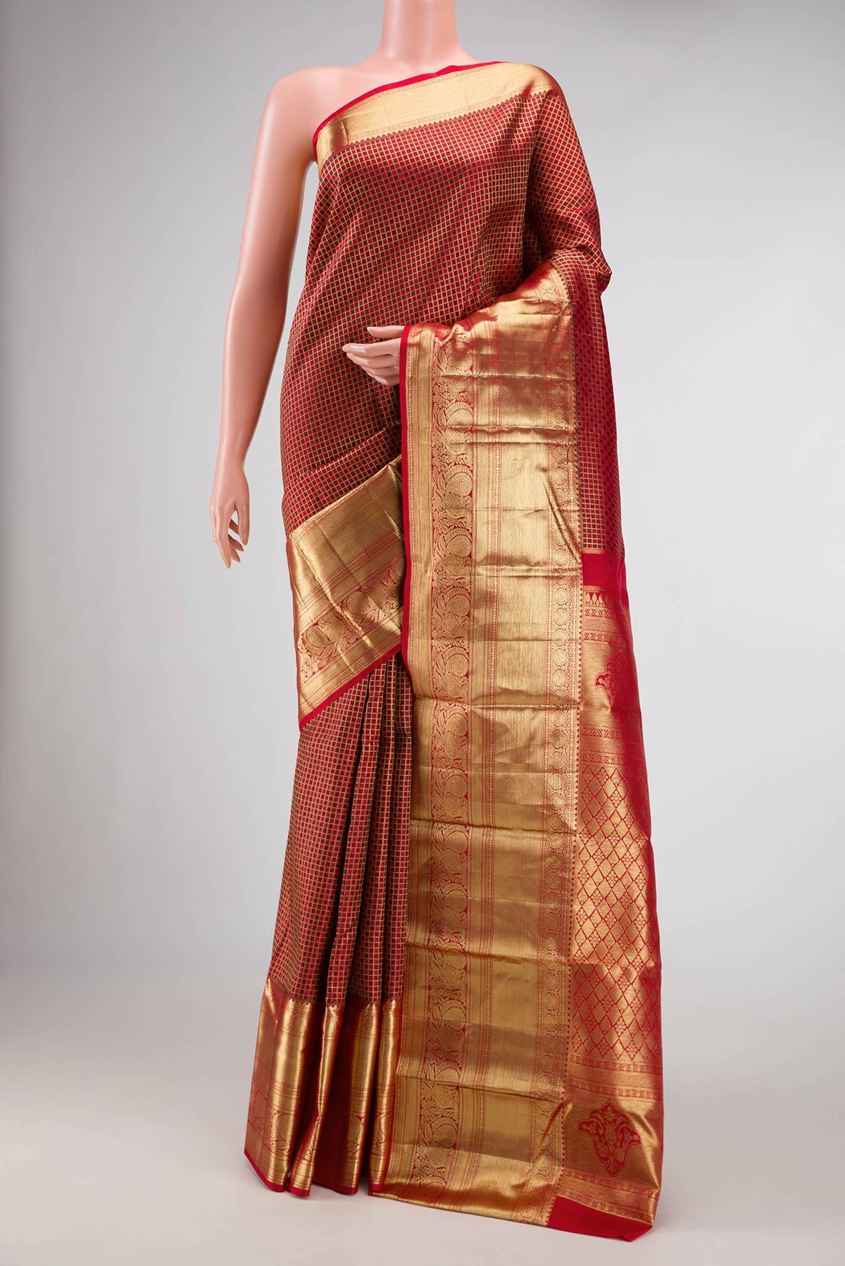 Red Dual Tone Kanchipuram Silk Saree with Zari Brocade on the body and Zari Border.  displayed on a mannequin