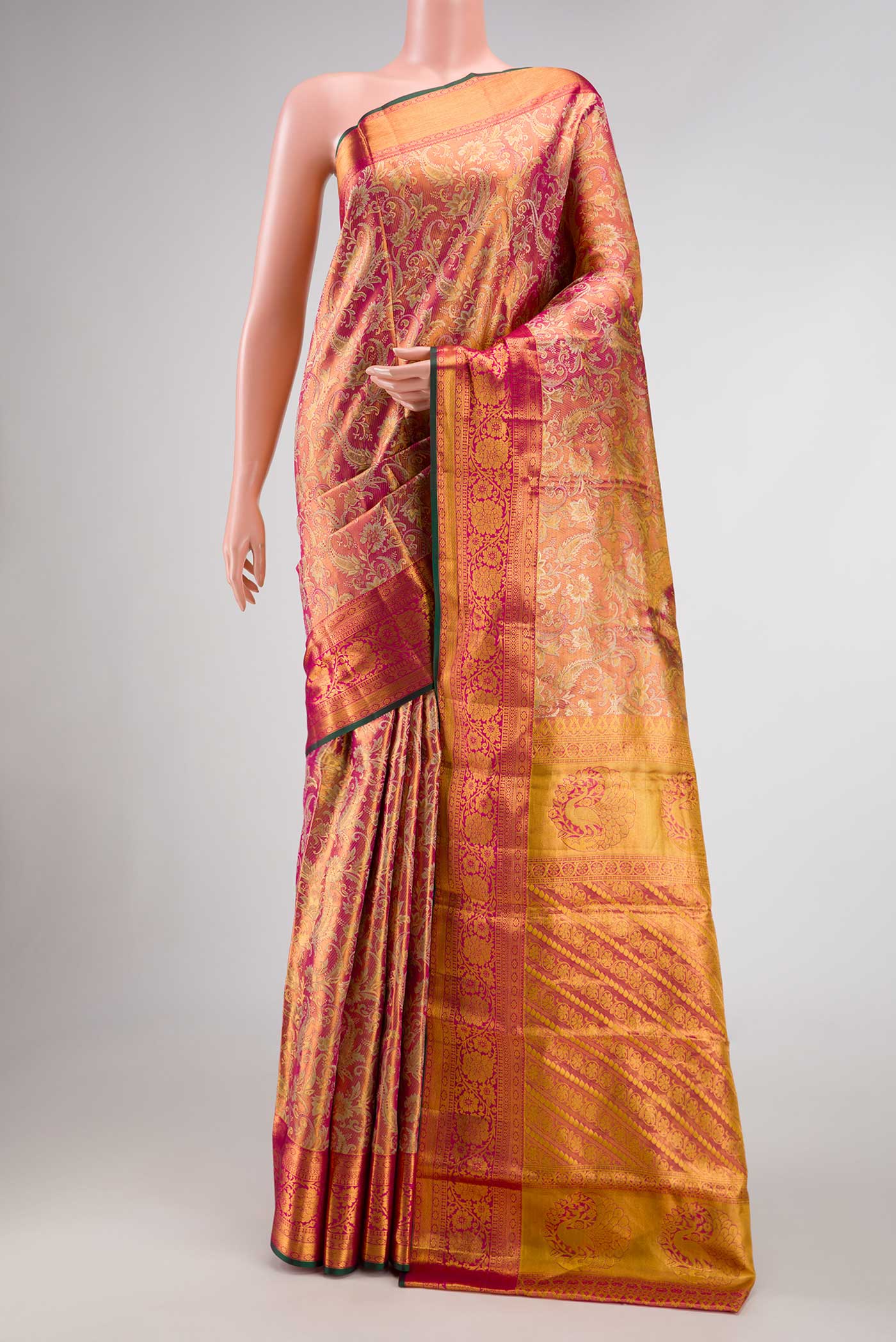 Dark Pink Dual Tone Kanchipuram Tissue Silk Saree with Zari Brocade on the body and Zari Border.  displayed on a mannequin