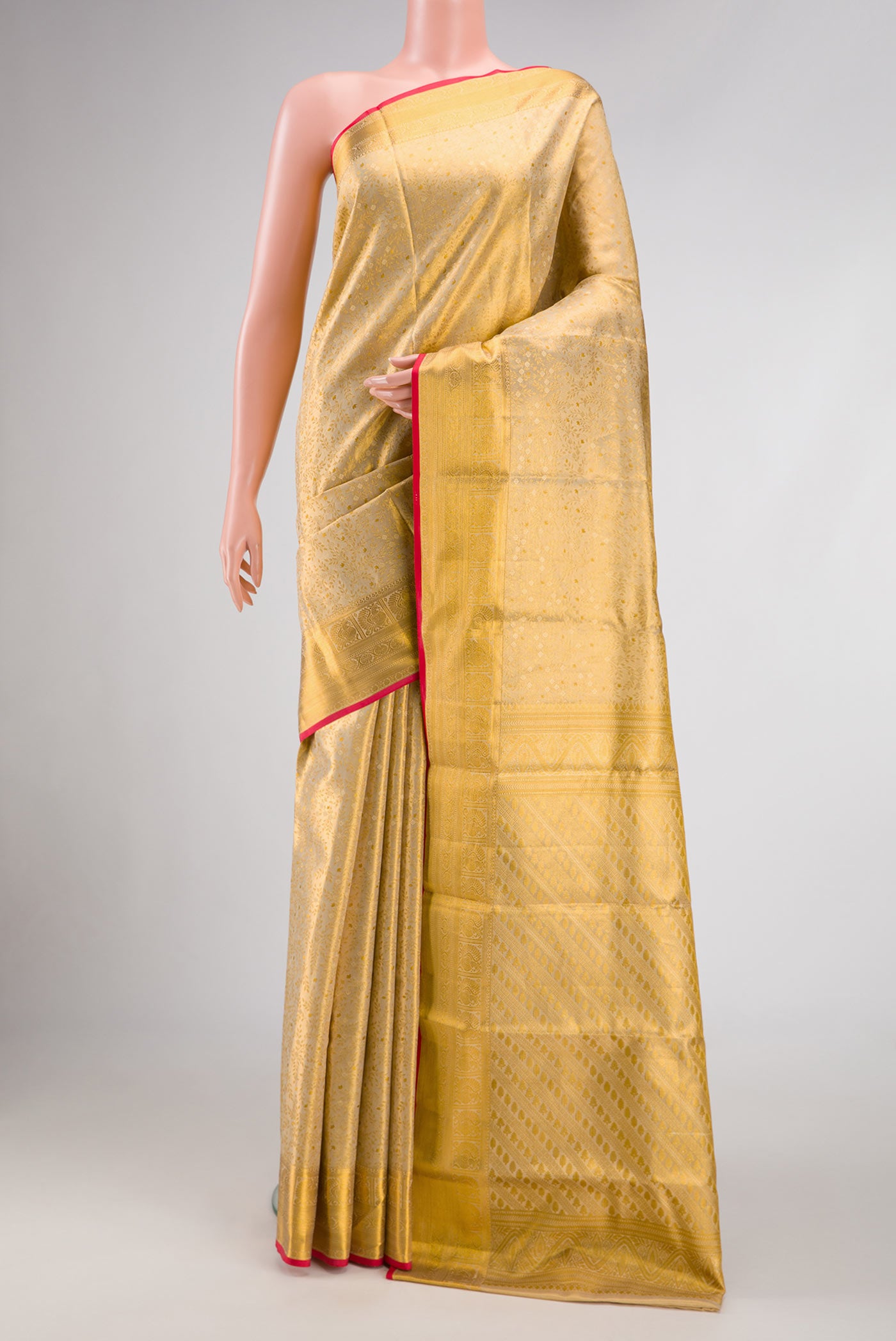 Gold Dual Tone Kanchipuram Tissue Silk Saree with Zari Brocade on the body and Zari Border.  displayed on a mannequin