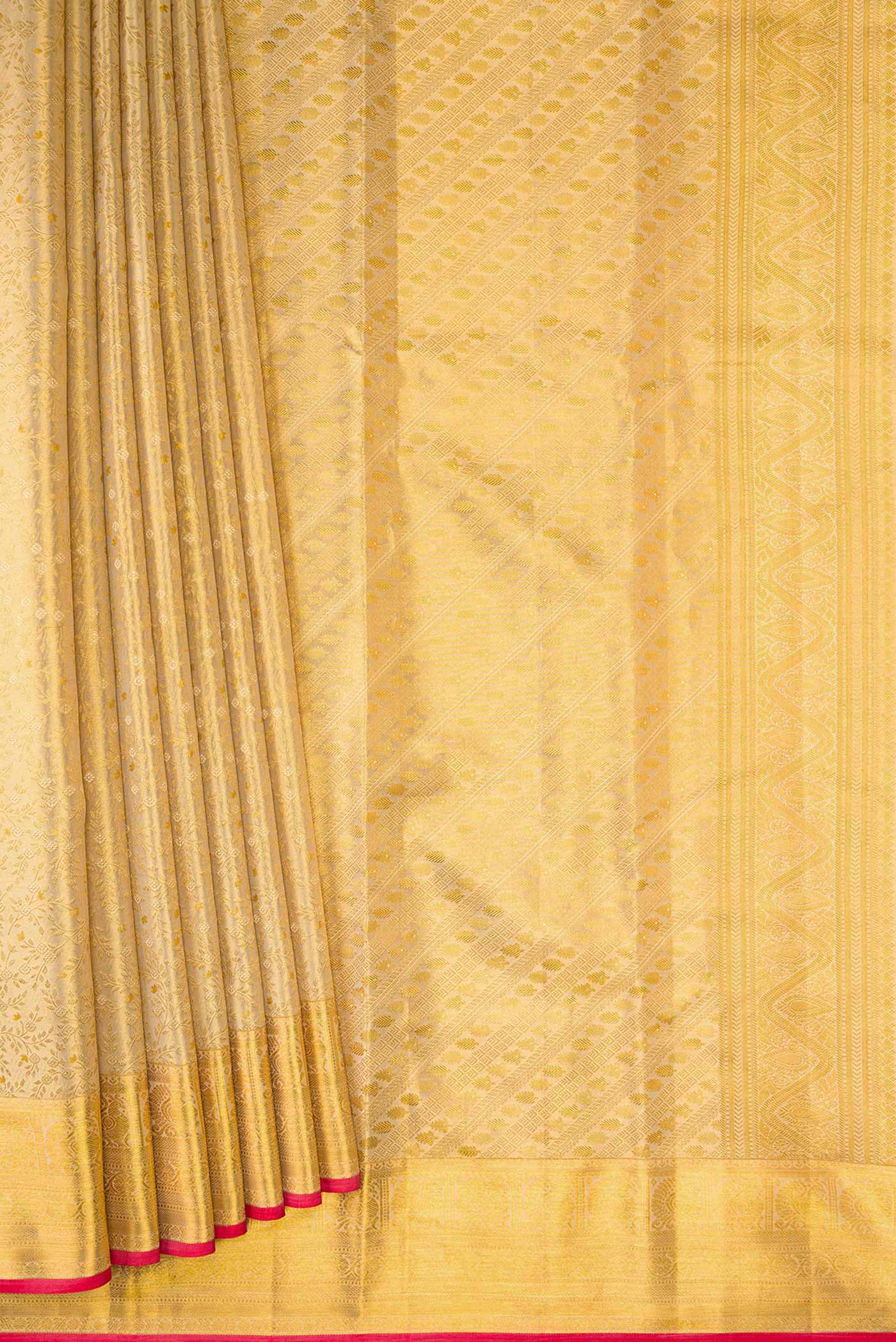 Pleats and pallu of Gold Dual Tone Kanchipuram Tissue Silk Saree with Zari Brocade on the body and Zari Border. 