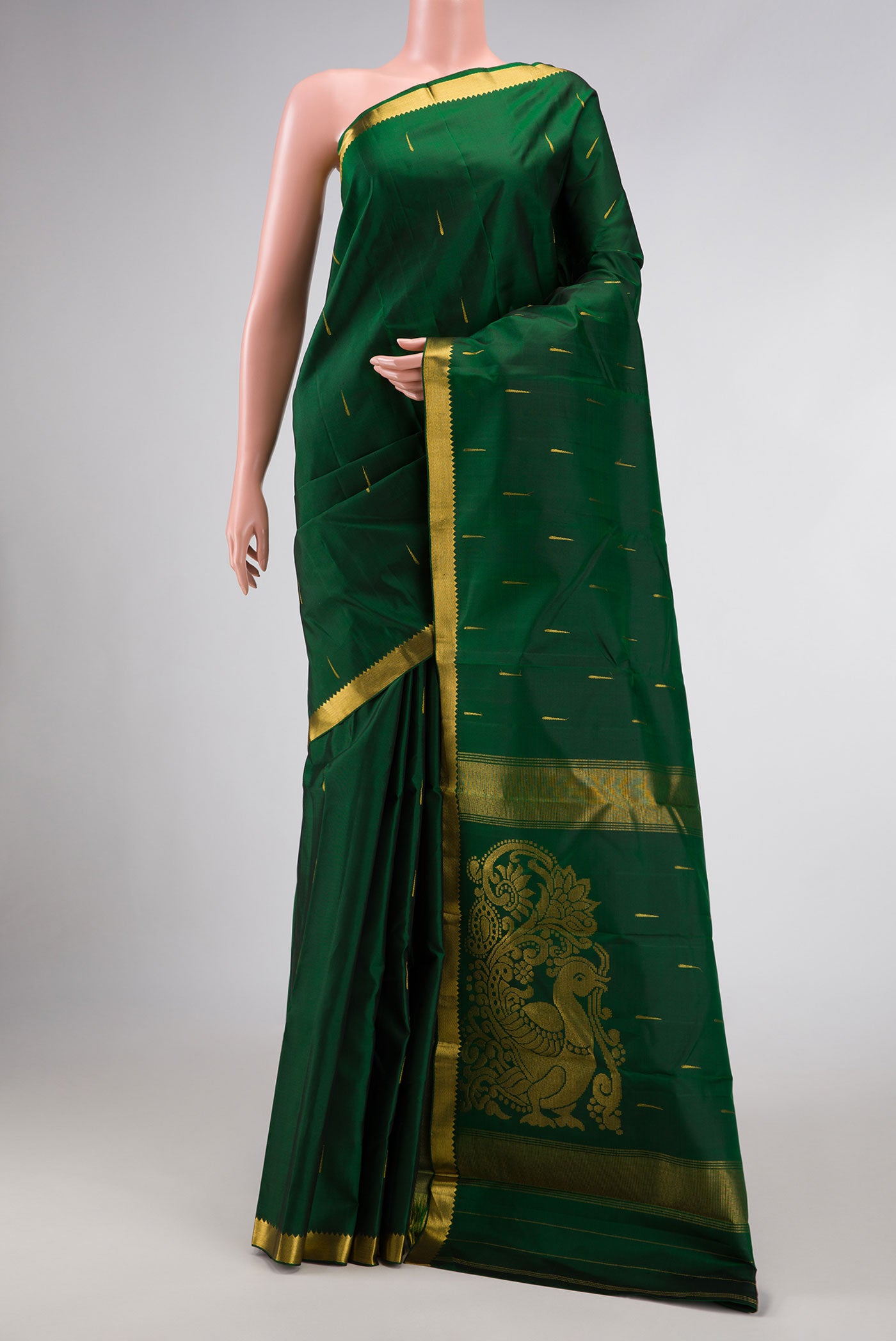 Bottle Green Dual Tone Kanchipuram Silk Saree with Zari Butta on the body and Zari Border.  displayed on a mannequin