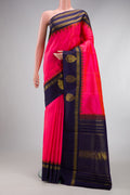 Pink Kanjivaram Silk Saree with Stripes on the body and Zari Border.  displayed on a mannequin