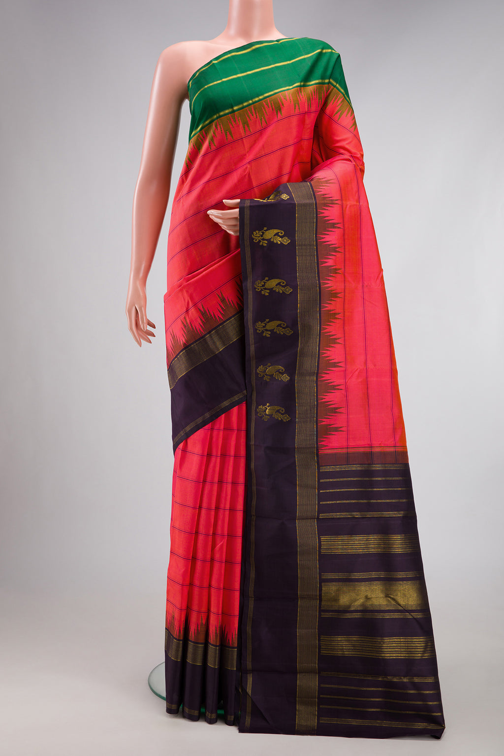 Coral Dual Tone Kanjivaram Silk Saree with Stripes on the body and Ganga Jamuna Border.  displayed on a mannequin