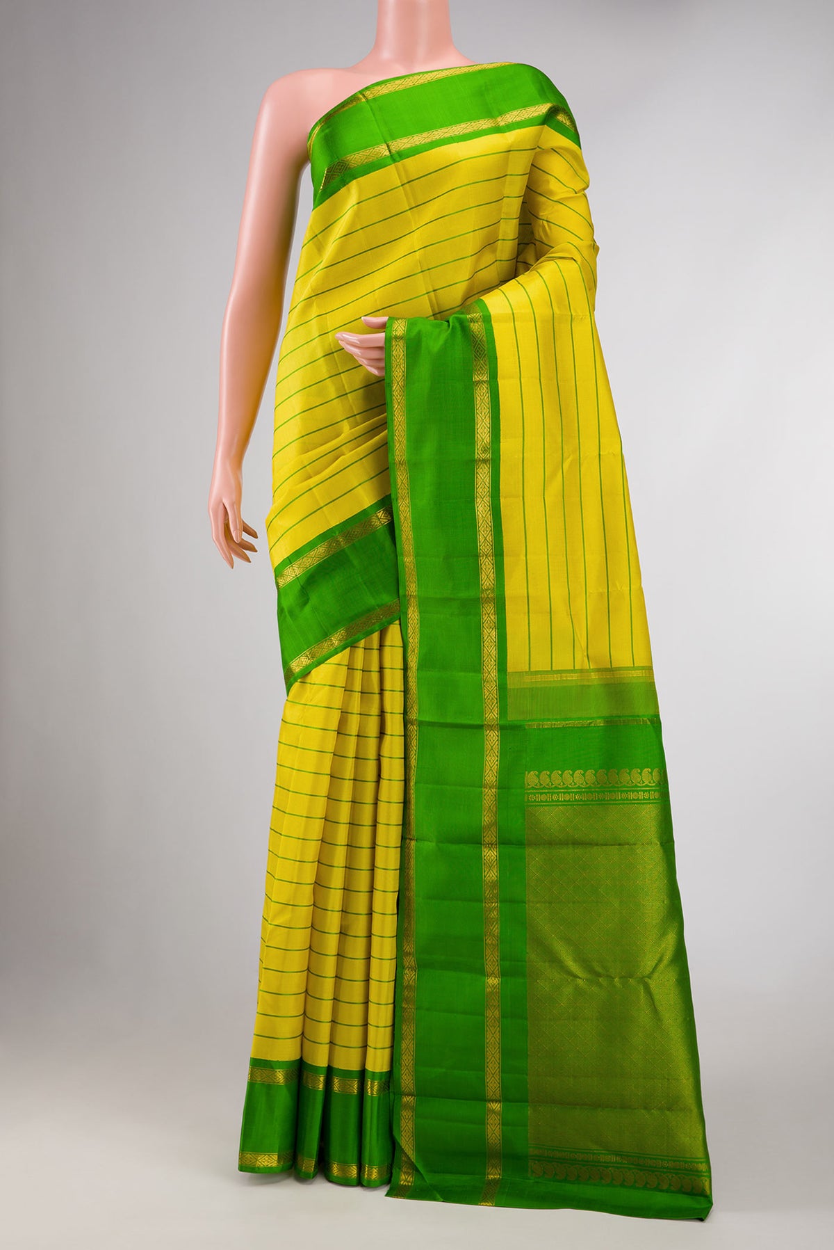 Yellow Dual Tone Kanchipuram Silk Saree with Stripes on the body and Zari Border displayed on a mannequin