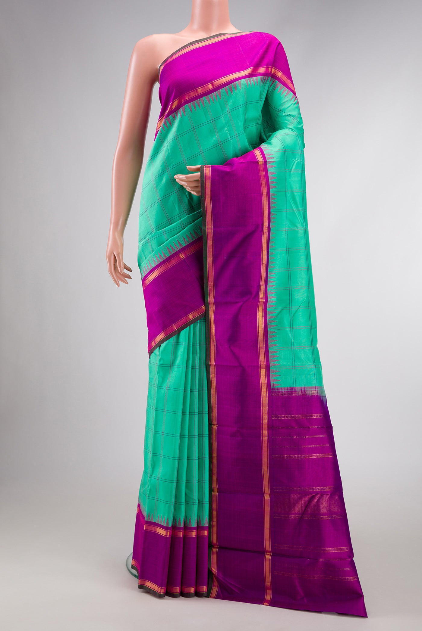 Pure Silk Pure Zari Sea Green Dual Tone Kanjivaram Saree with Checked design on the body and Zari And Thread Border.  displayed on a mannequin